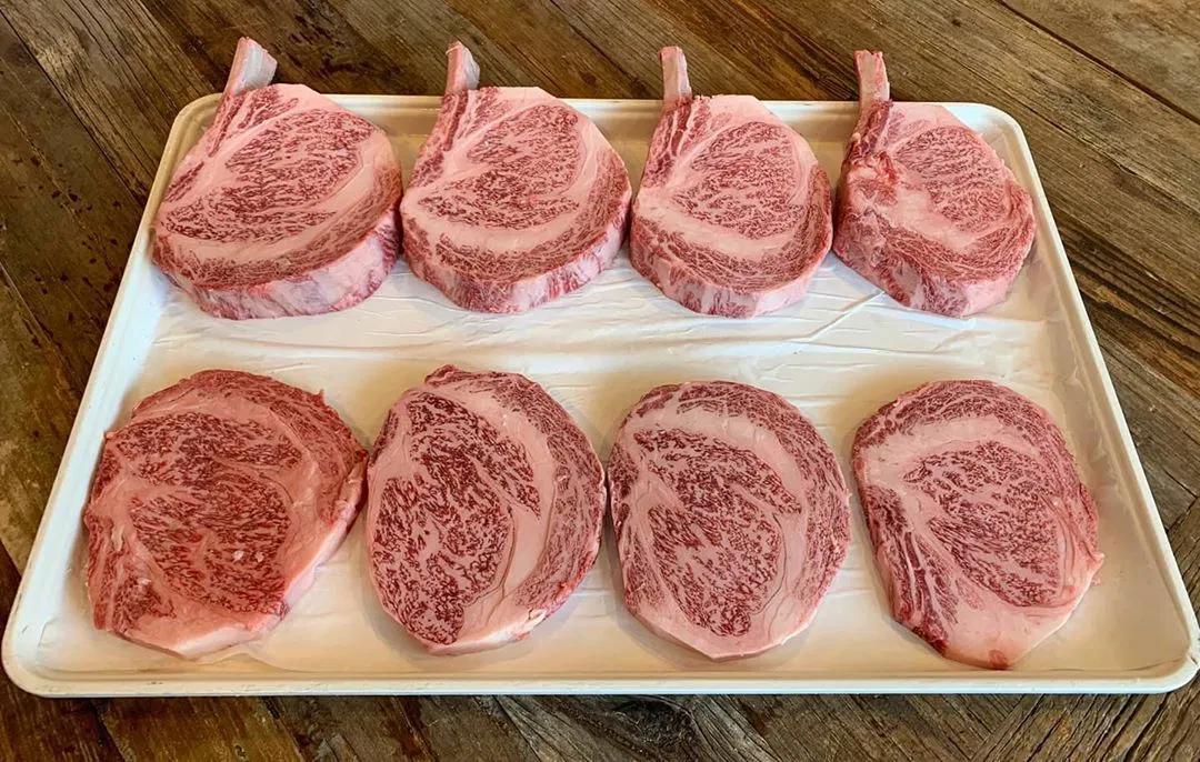 ultra-wagyu-ribeye-steaks-on-white-tray.webp