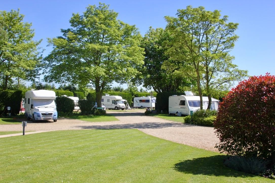 Telta awning set up with a tranquil lake in the background