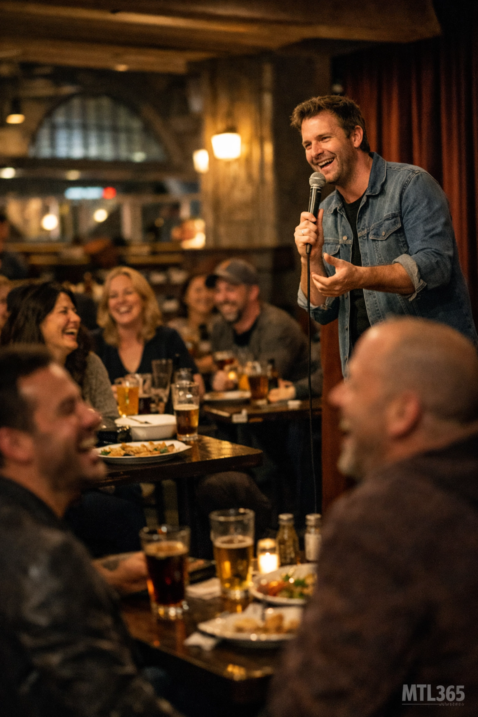 A live stand-up comedy show performance at a cozy Montreal restaurant and bar with a laughing audience.