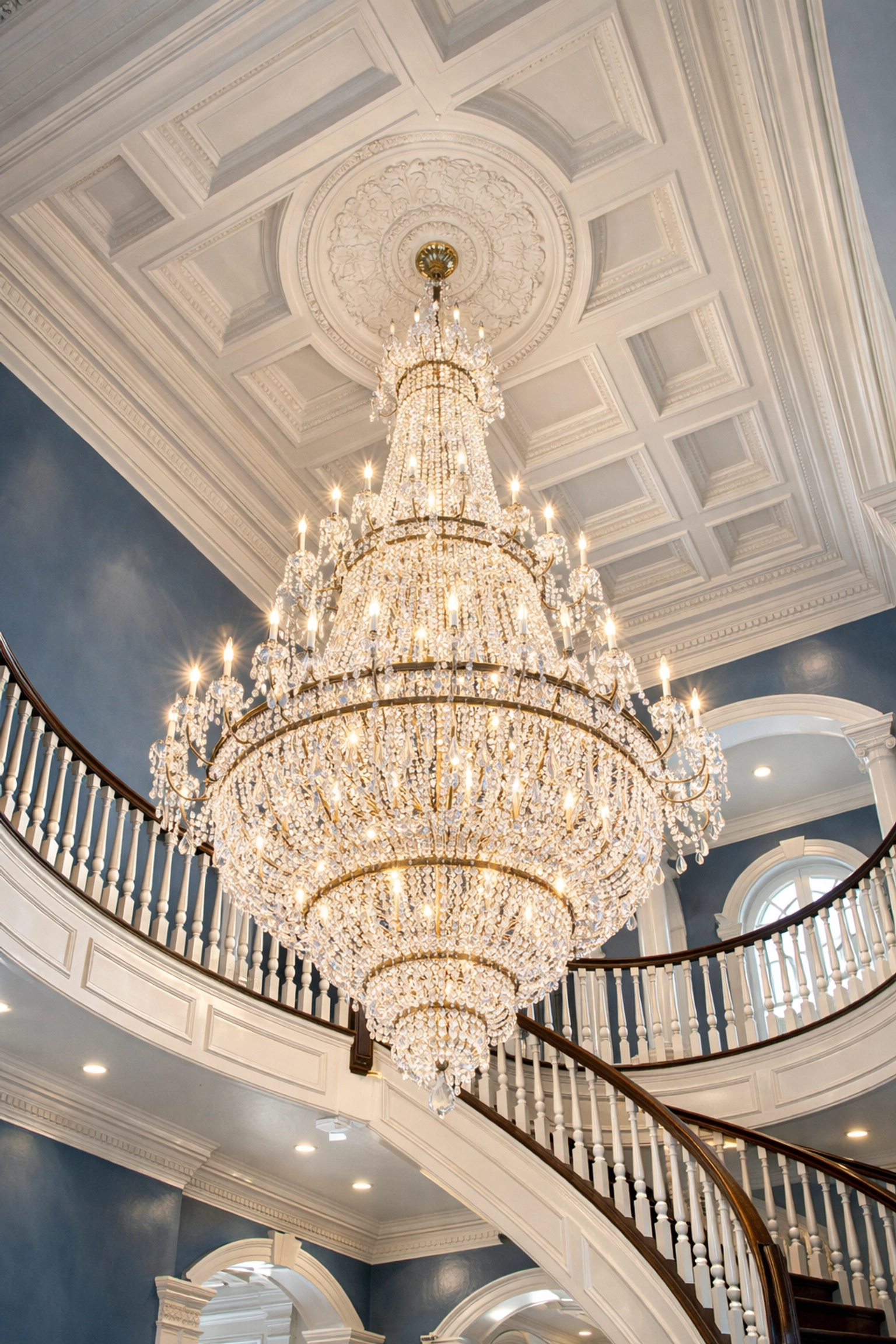 Grand foyer with high ceilings and crystal chandelier, professionally dusted by Ninja-Fast Cleaning in Dover.