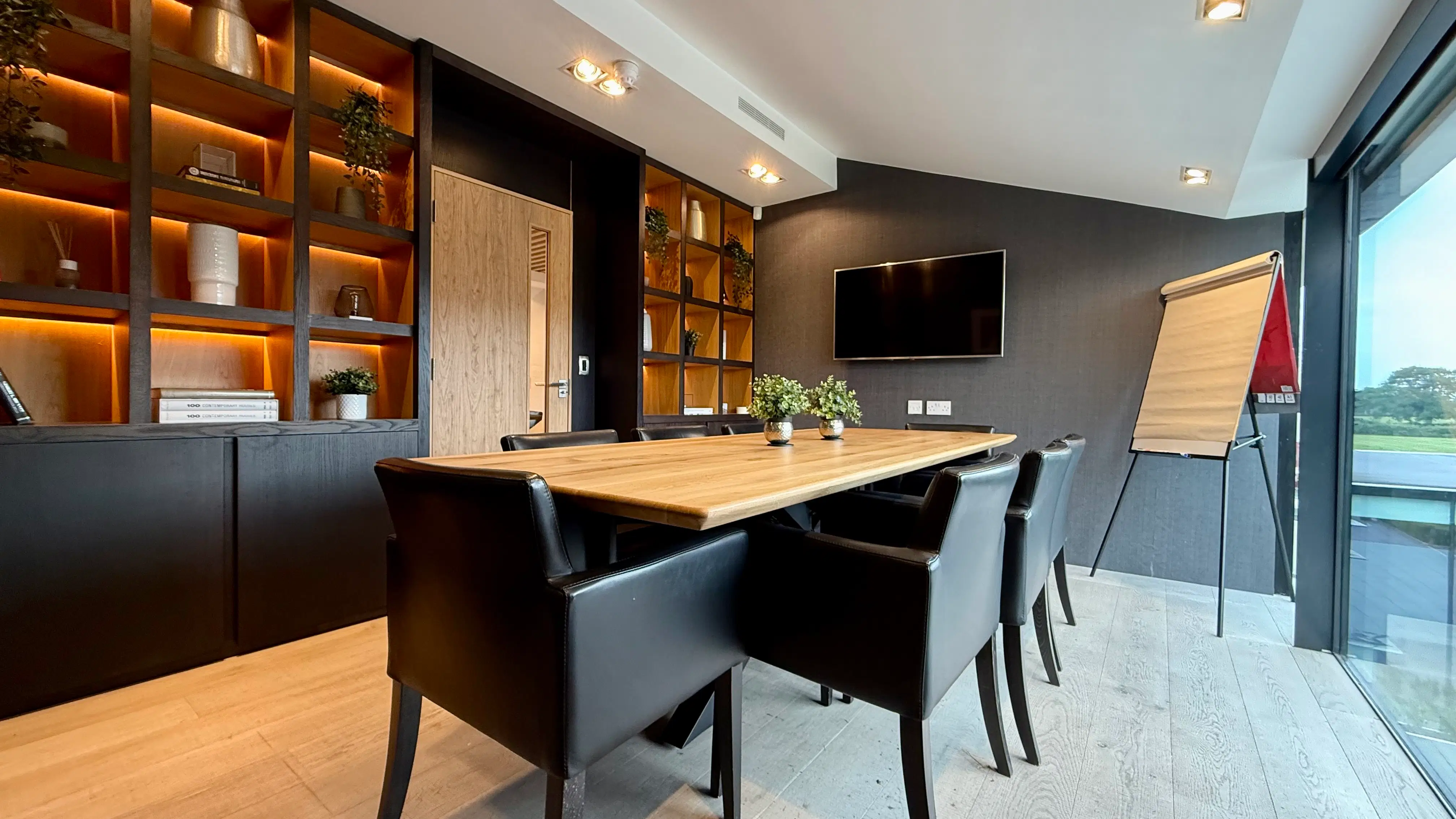 Executive private meeting room with modern oak table
