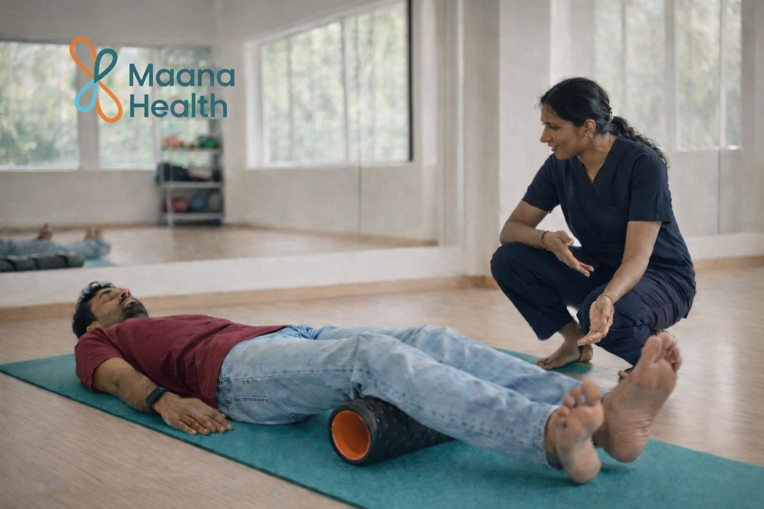 Patient using foam roller with physical therapist