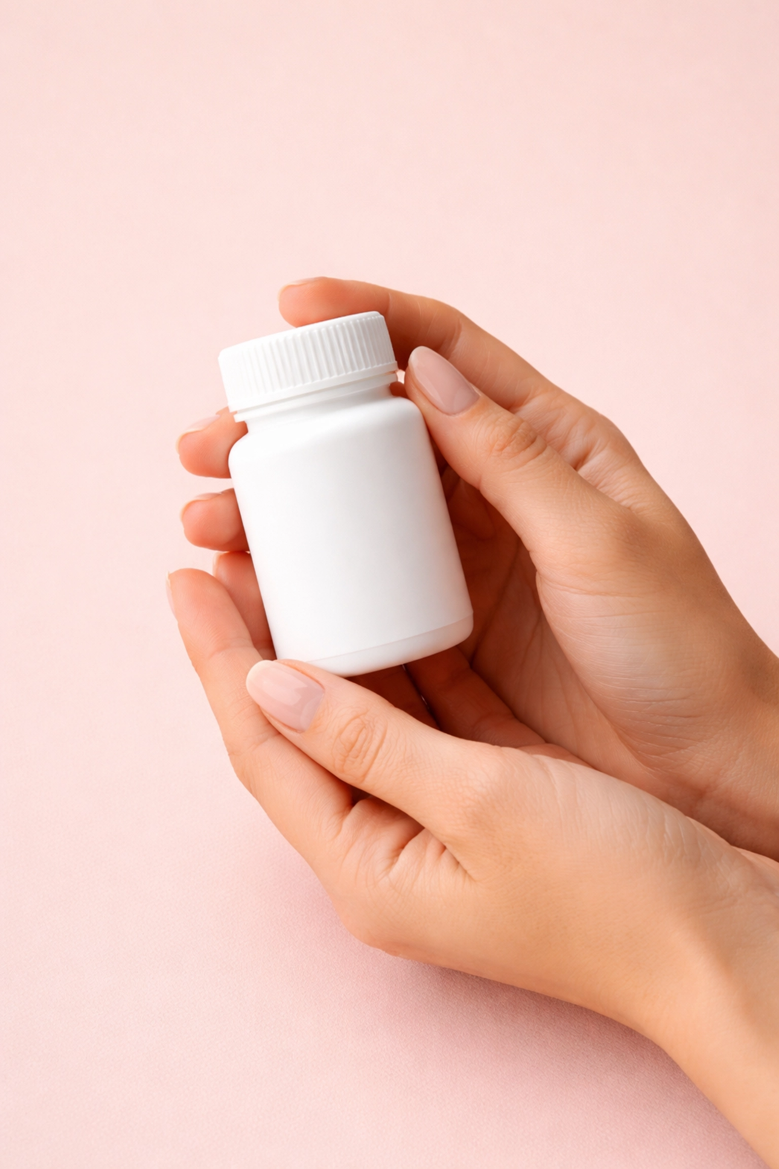 Hands holding a prescription bottle, emphasizing careful dosing and prescription of Low Dose Naltrexone.