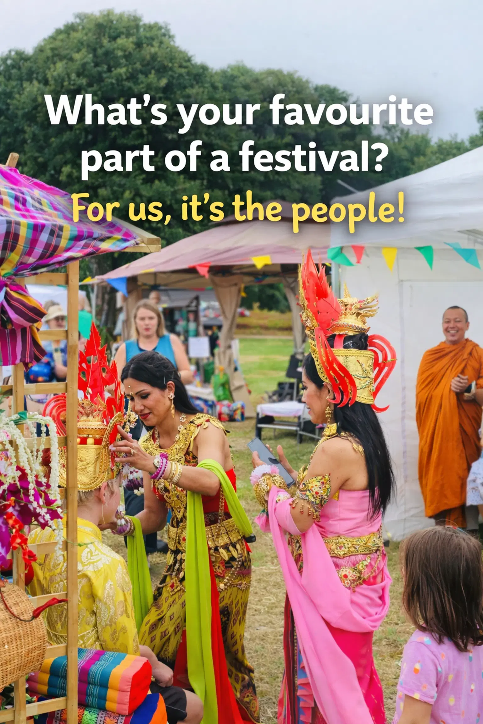 Traditional dancers in ornate costumes from Southeast Asia interact warmly with festivalgoers, including dressing a visitor in cultural attire.