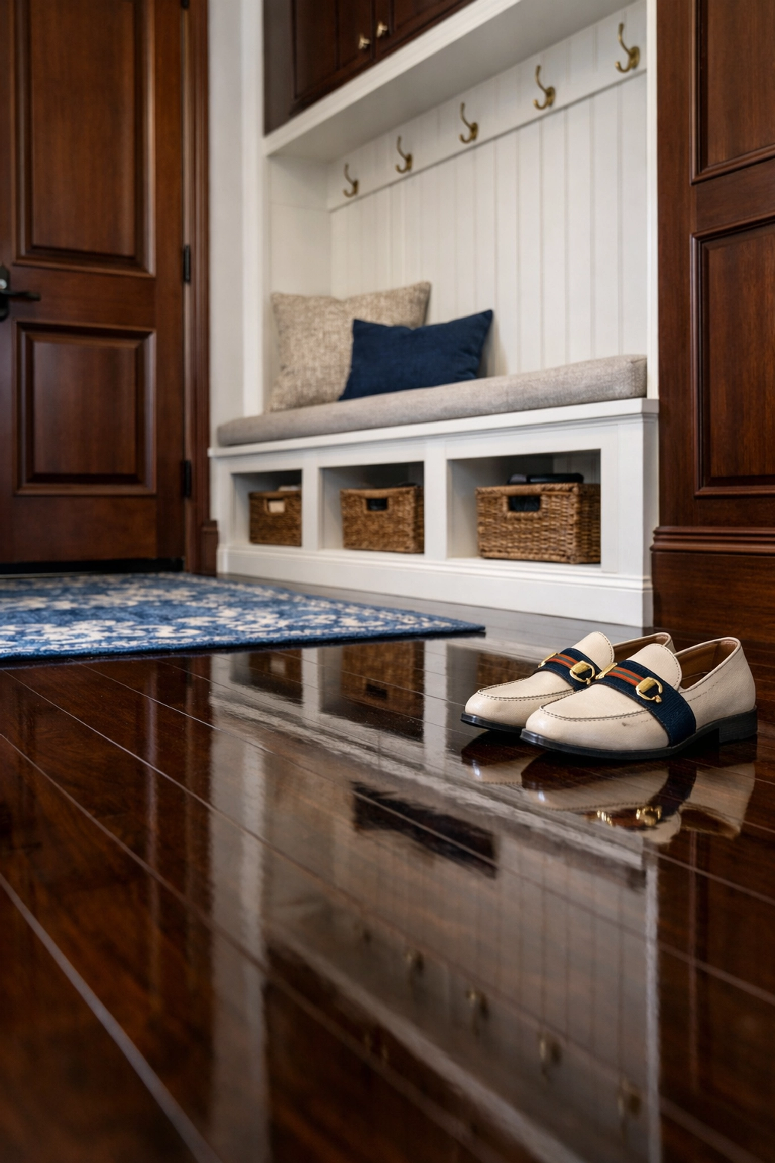 Reflective dark wood entryway floors in an Easton residence after professional house cleaning services.