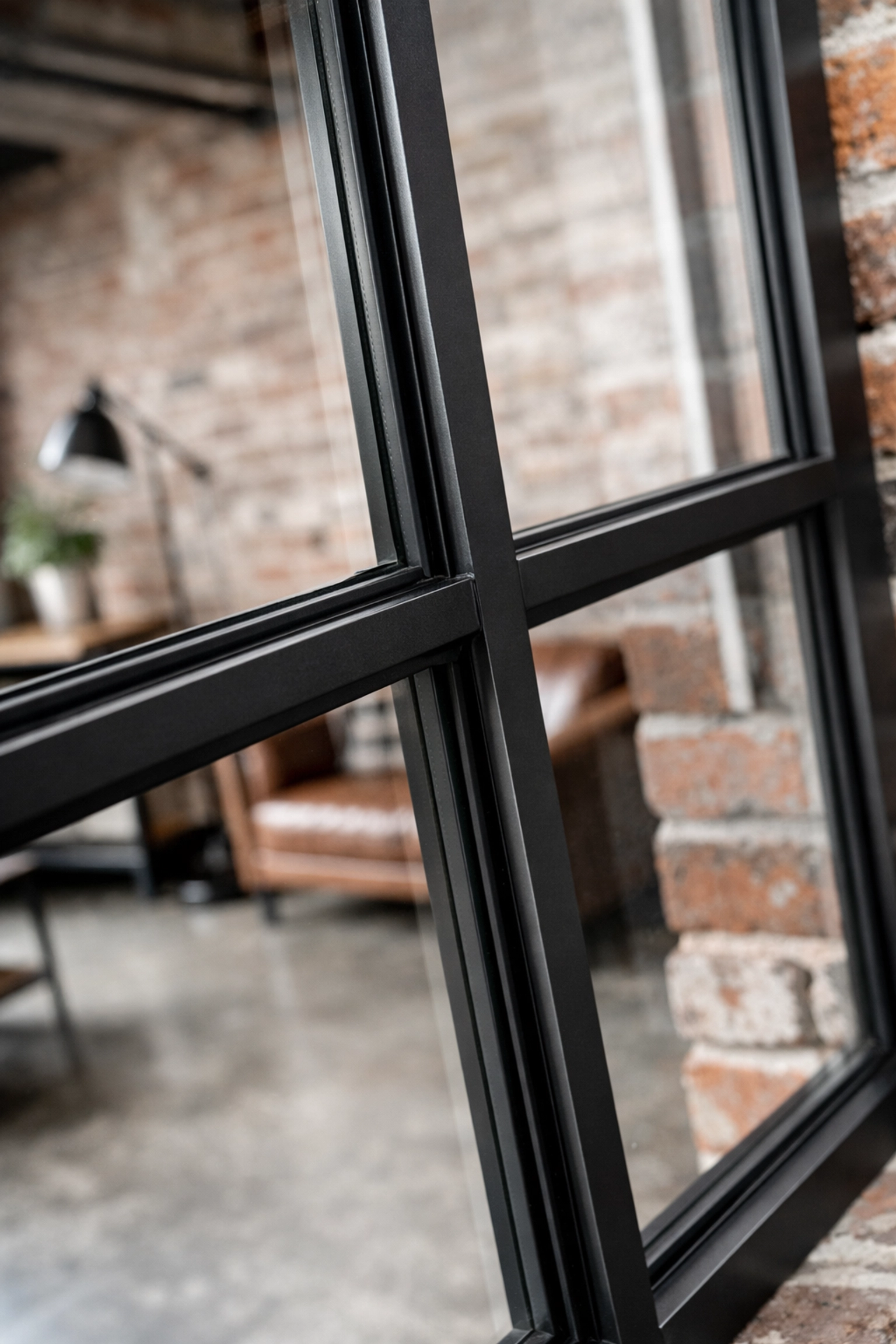 Slim secondary glazing units fitted to industrial Crittall windows in a Shoreditch loft.