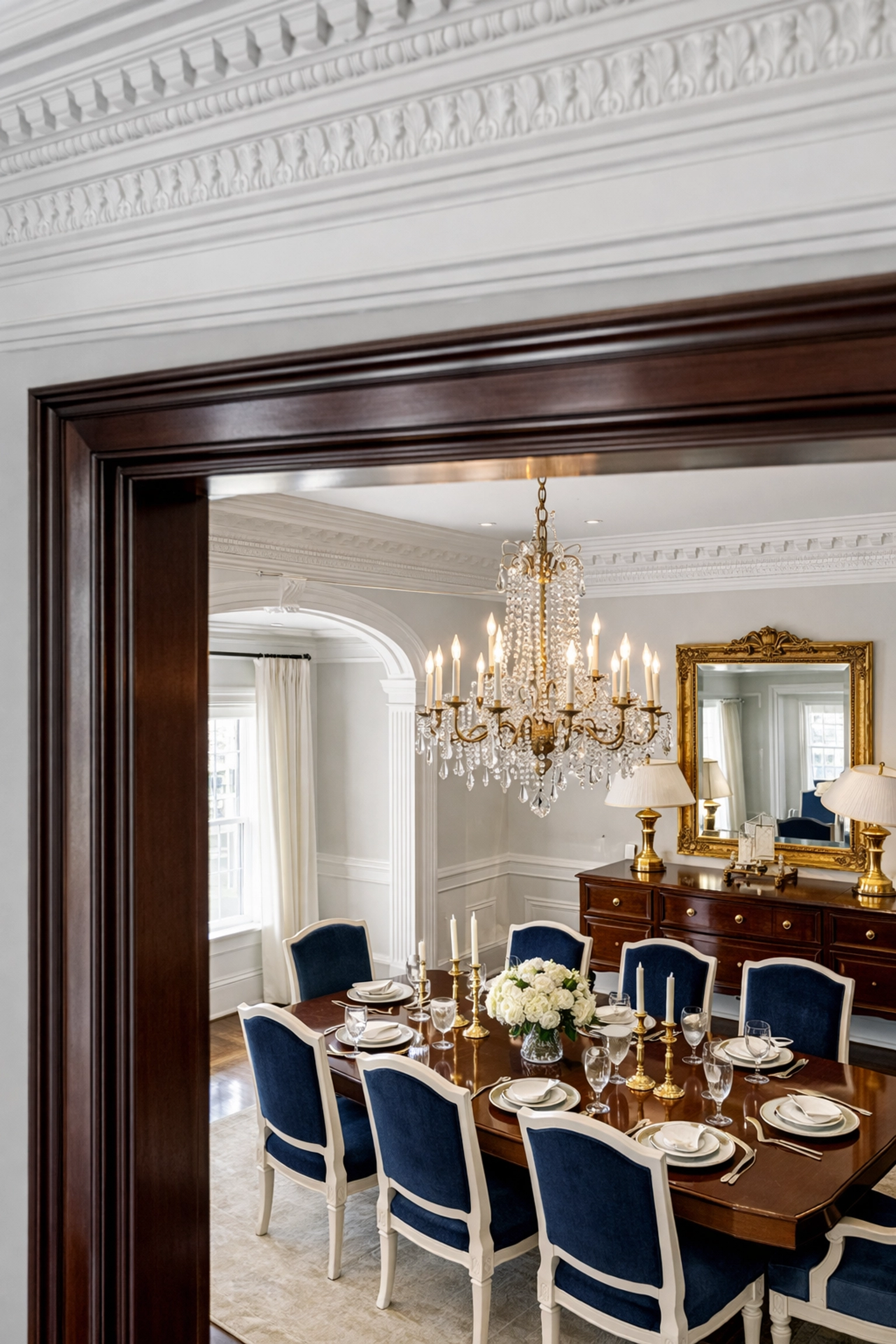 Meticulous luxury house cleaning in Southborough focusing on dust-free mahogany door frames and crown molding.