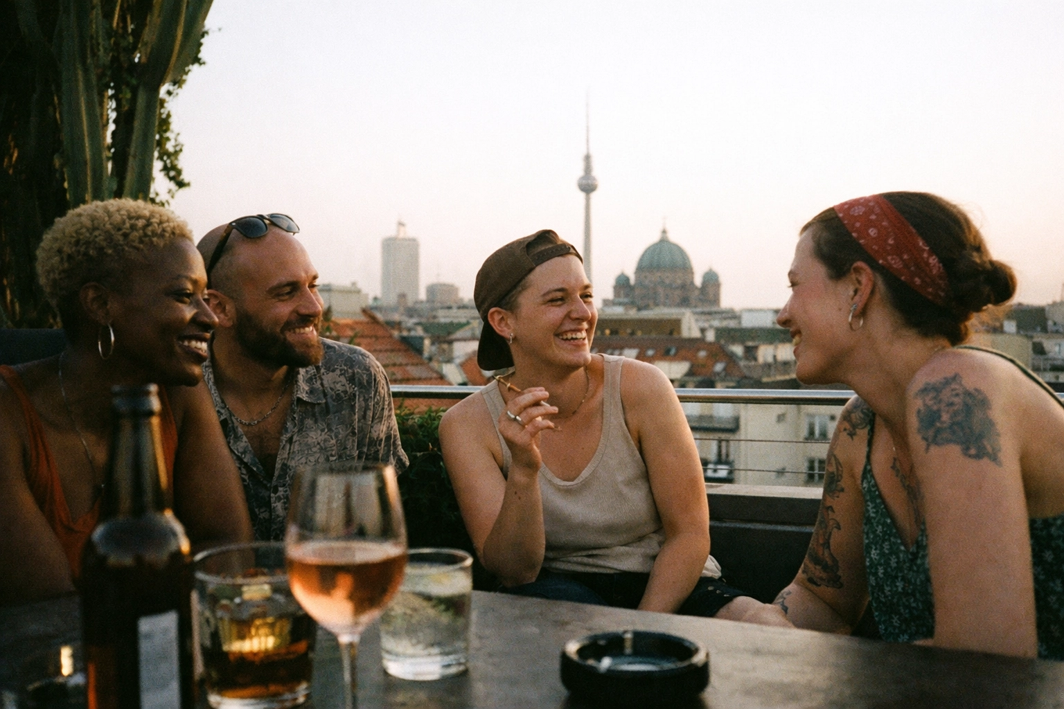 Summery rooftop view at Grace Rooftop (Hotel Zoo), golden hour and calm conversation.