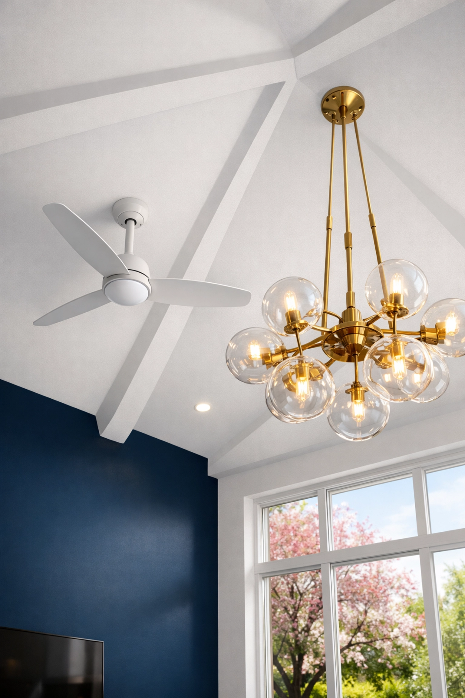 Dust-free ceiling fan and designer light fixture reflecting a thorough top-down cleaning strategy.