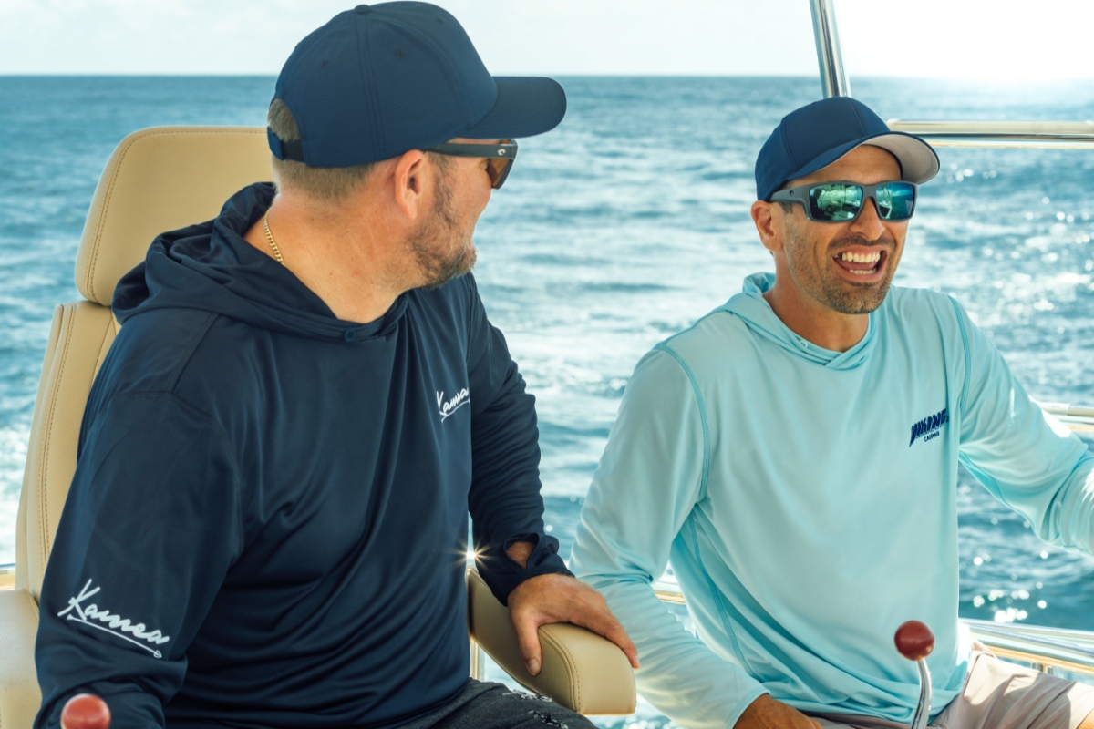 Crew on the yacht in Mkaira custom hooded shirts built for offshore conditions