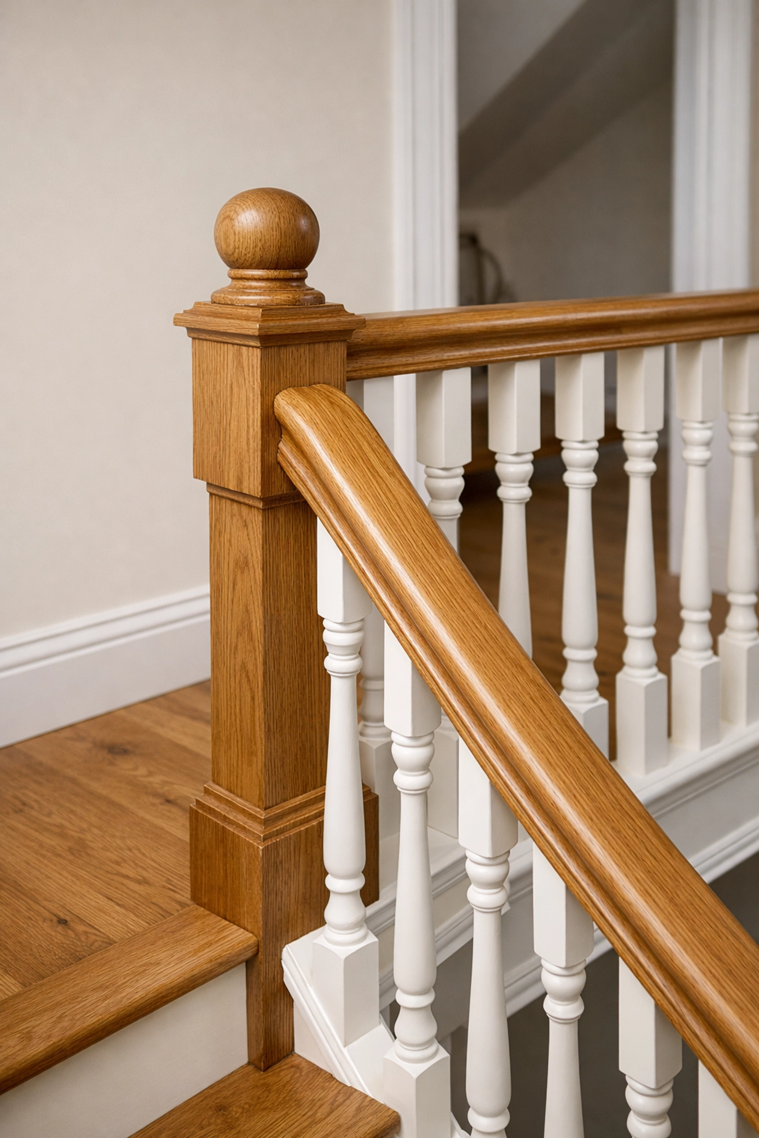 Bespoke Victorian style wooden staircase with oak handrails for a high-quality London loft conversion.