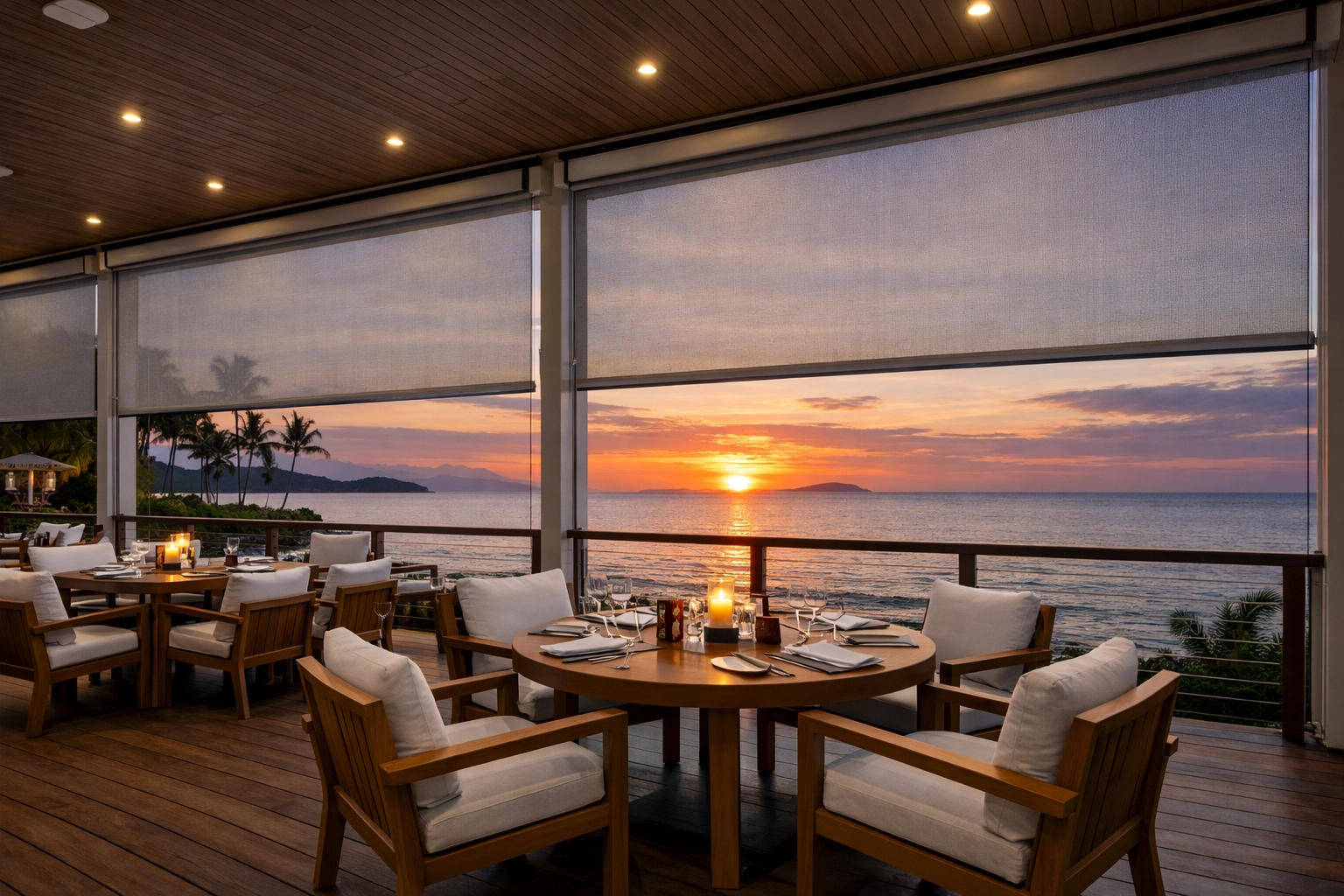 Motorised outdoor shading solutions at a Fiji resort providing a sheltered dining area with ocean views.