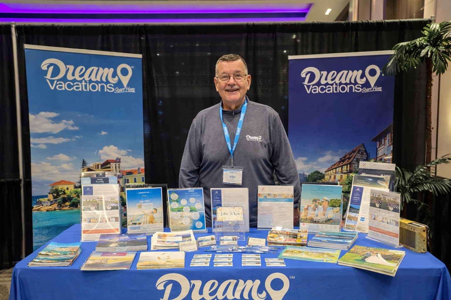 GNT Travel Pros trade show booth with staff member