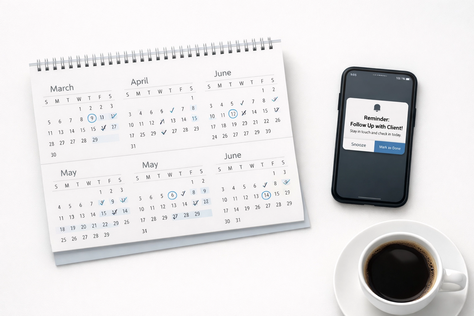 Desk calendar and phone with reminders for year-round tax client communication