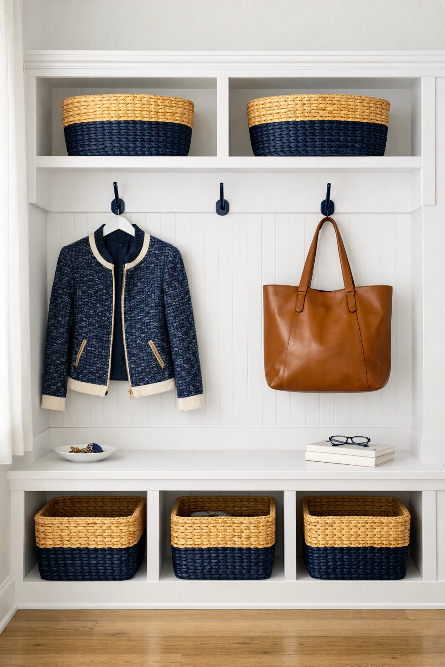 Organized entryway storage baskets and hooks for efficient residential cleaning in Leominster MA.