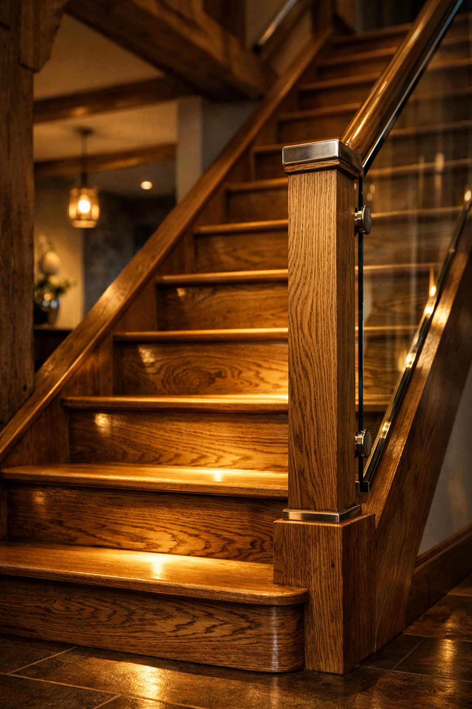Custom oak staircase with LED lighting in a premium West Sussex bungalow renovation.