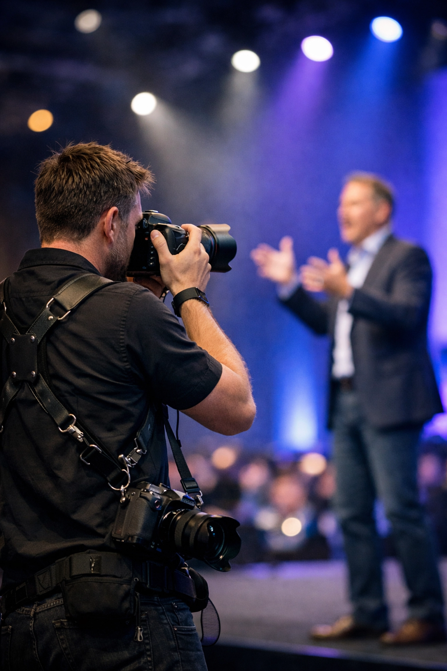 Photographer capturing documentary-style candid shots at a tech summit for Today's Photography & Videography News.