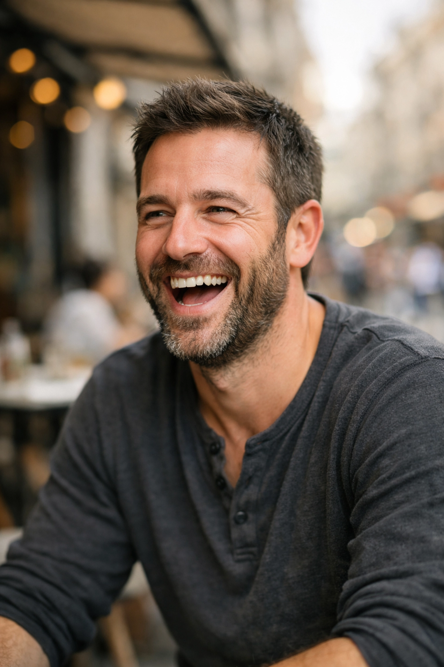 A candid laughing portrait illustrating natural posing and professional portrait photography techniques.