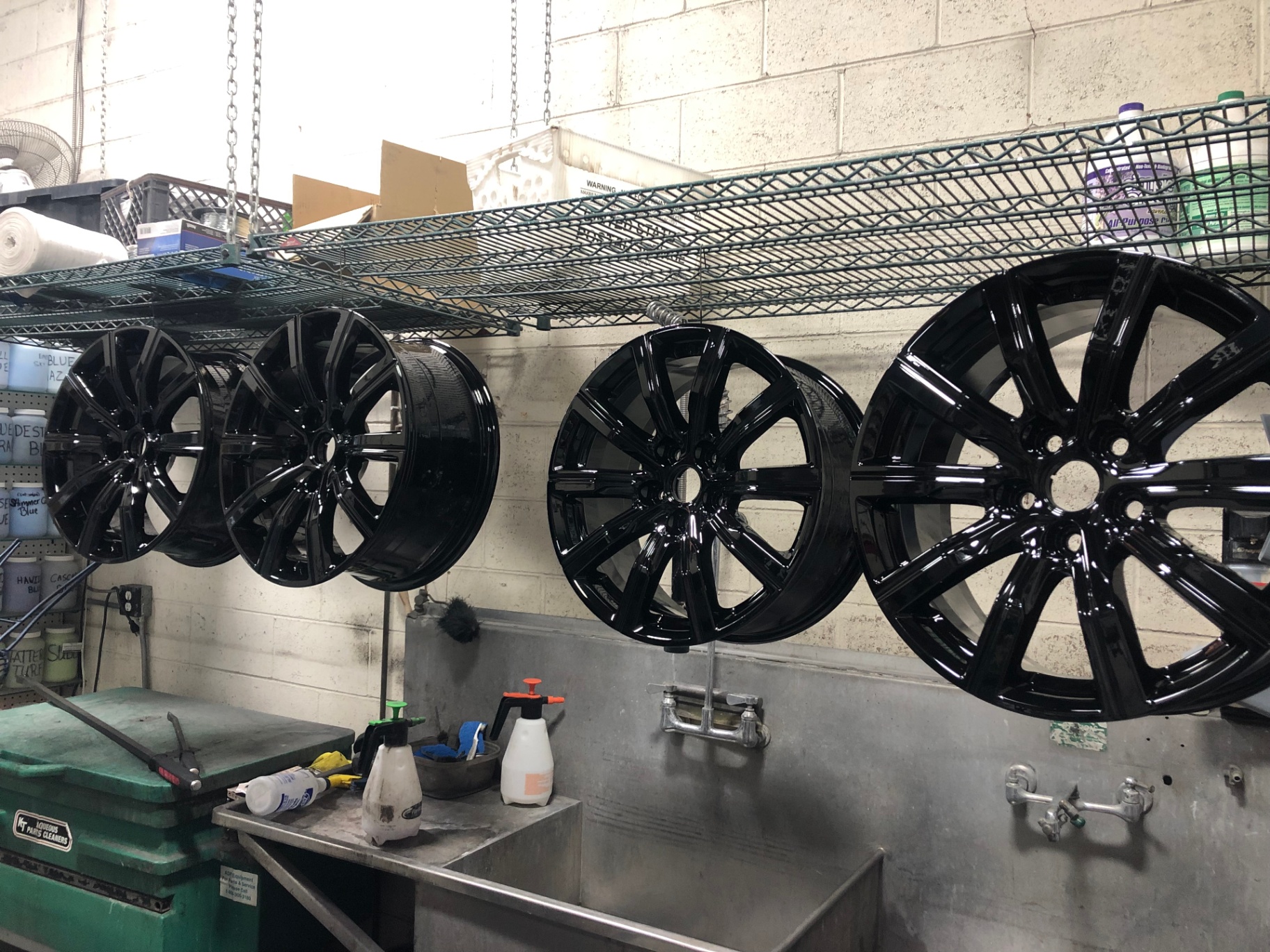 Freshly powder-coated black alloy wheels