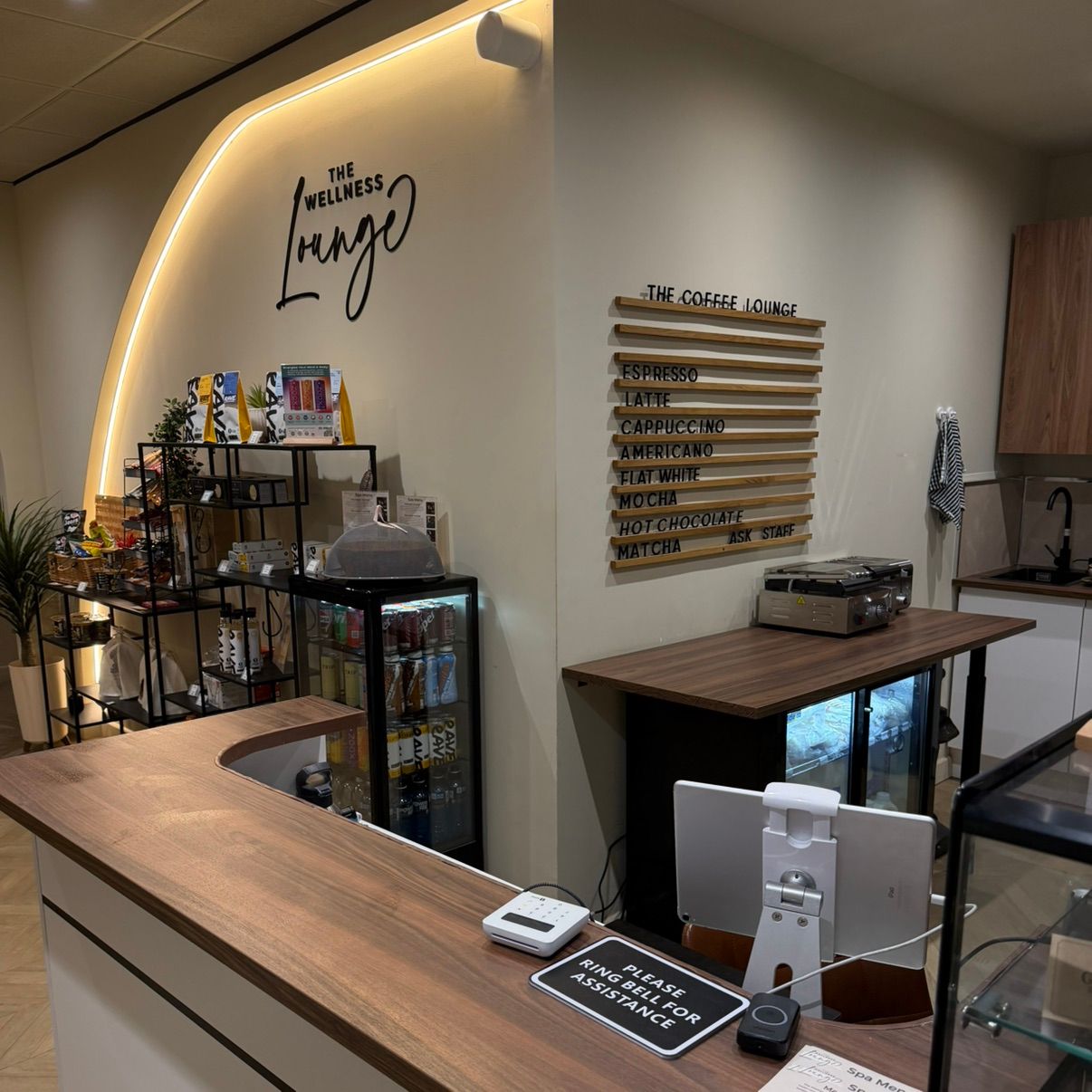 The Coffee Lounge counter at The Wellness Lounge, featuring a warm and welcoming atmosphere.