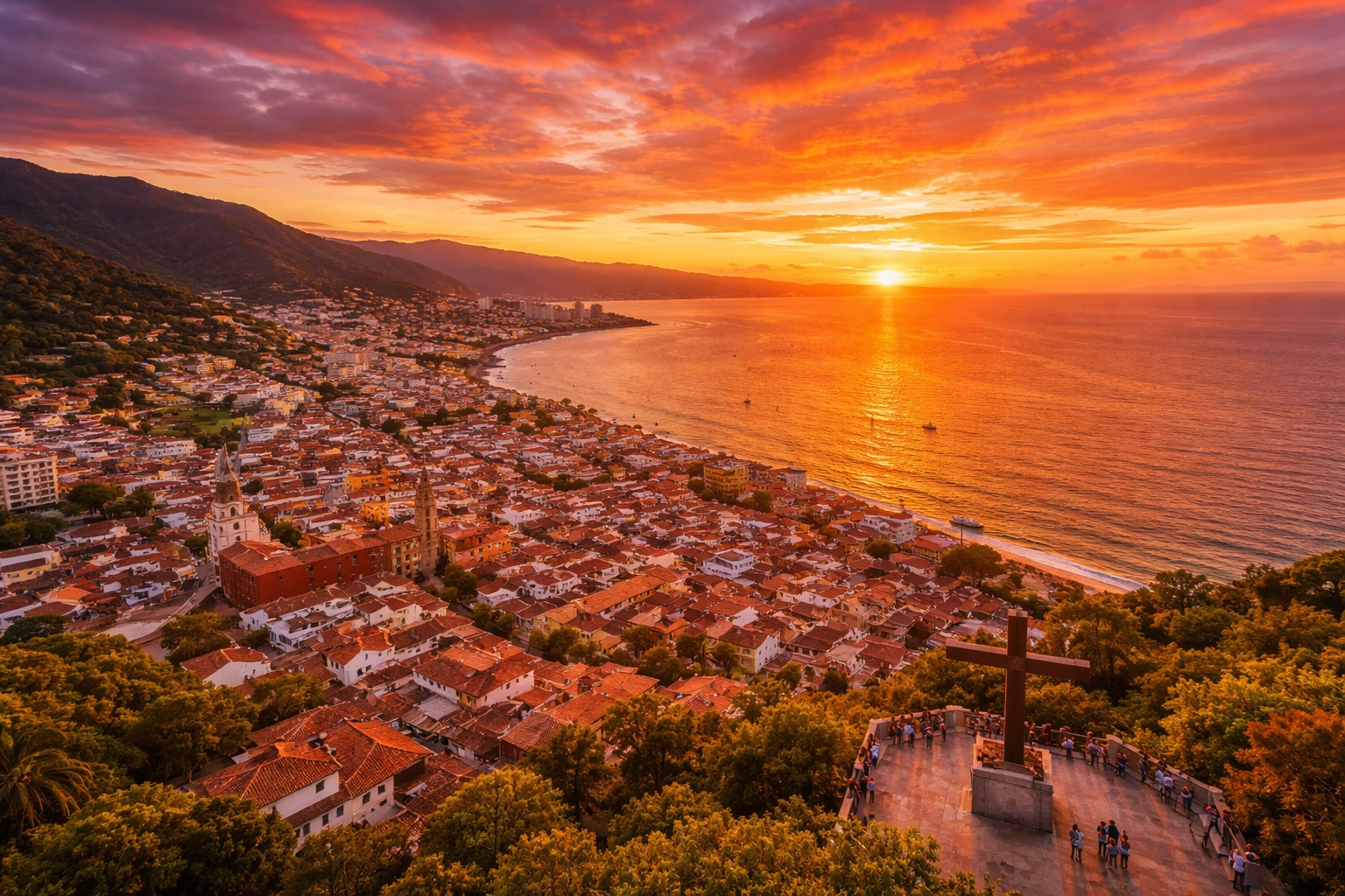 Aerial sunset view from Cerro de la Cruz showcasing Puerto Vallarta, Banderas Bay, and mountains
