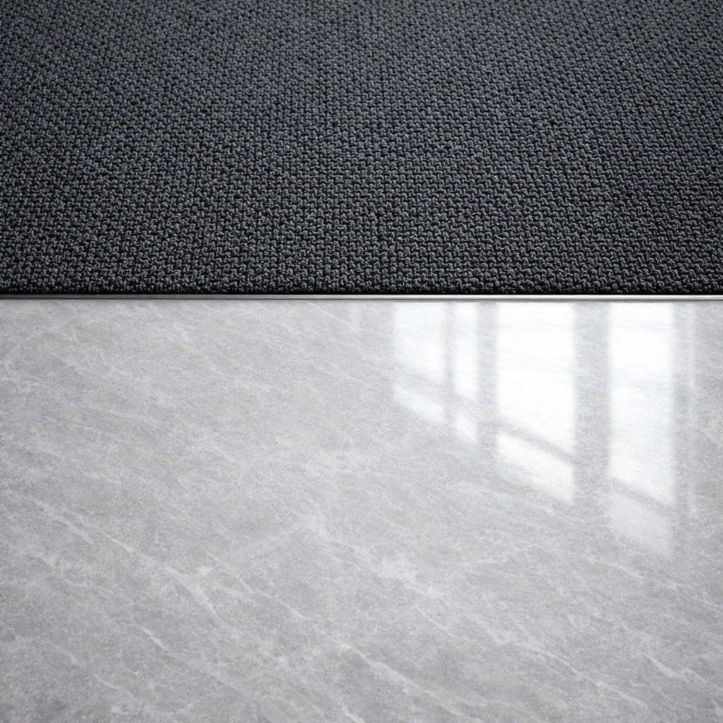 Commercial carpet and polished marble floor transition showing professional office floor maintenance.