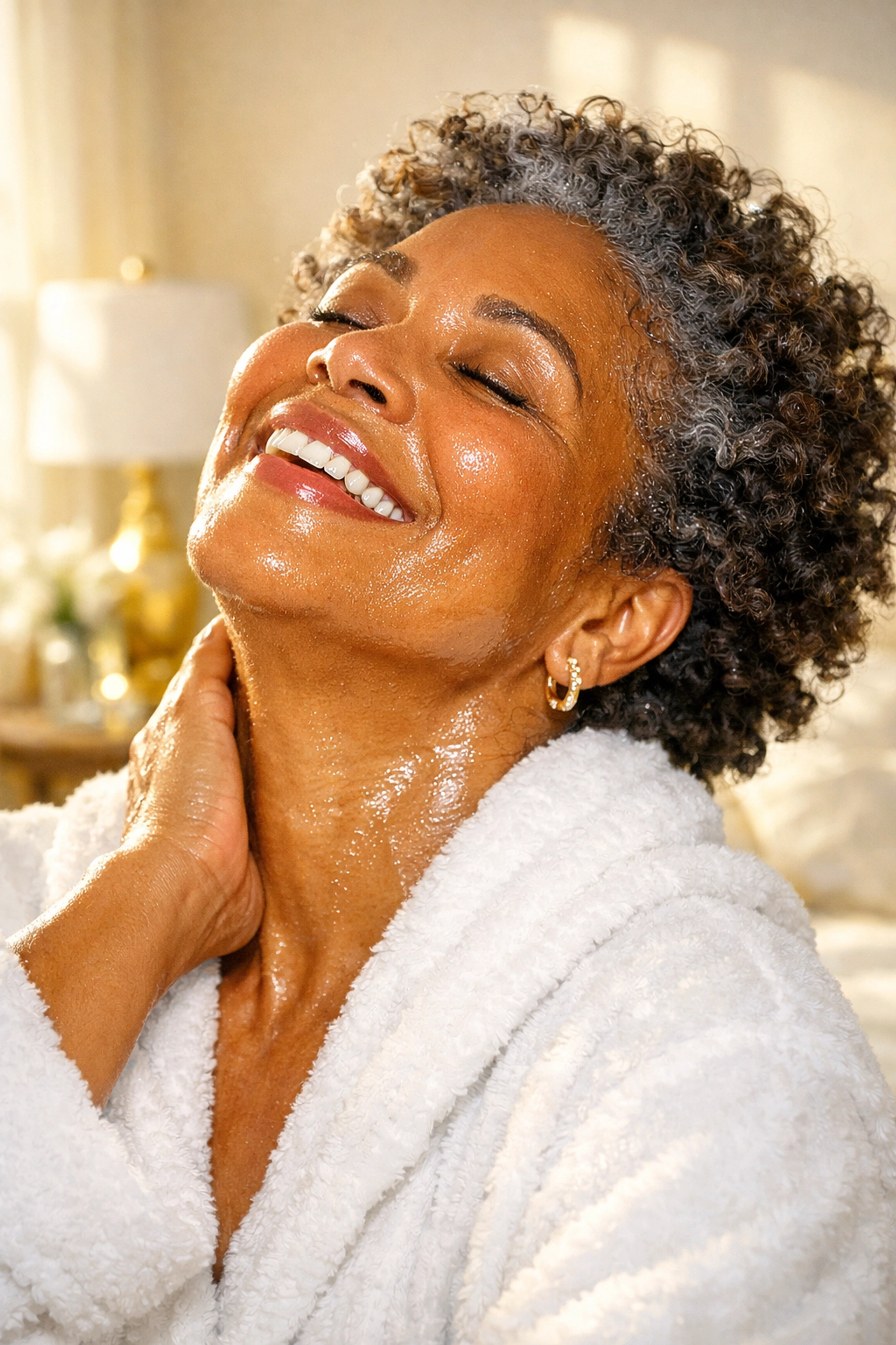 Afro-Latina woman with glowing skin using a brightening serum for dark skin.