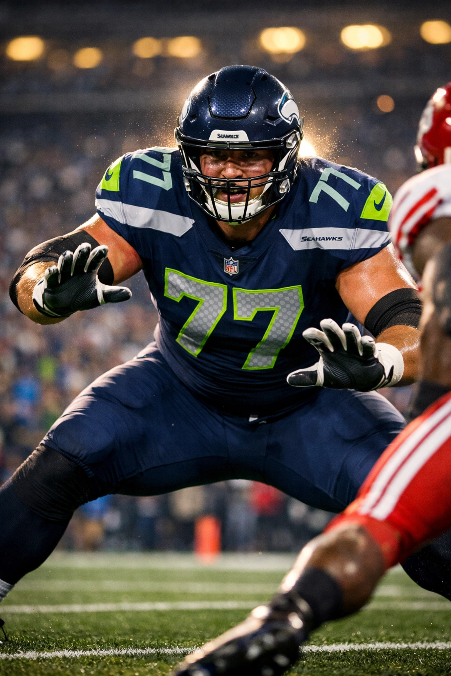 NFL offensive lineman in pass protection blocking for quarterback during game