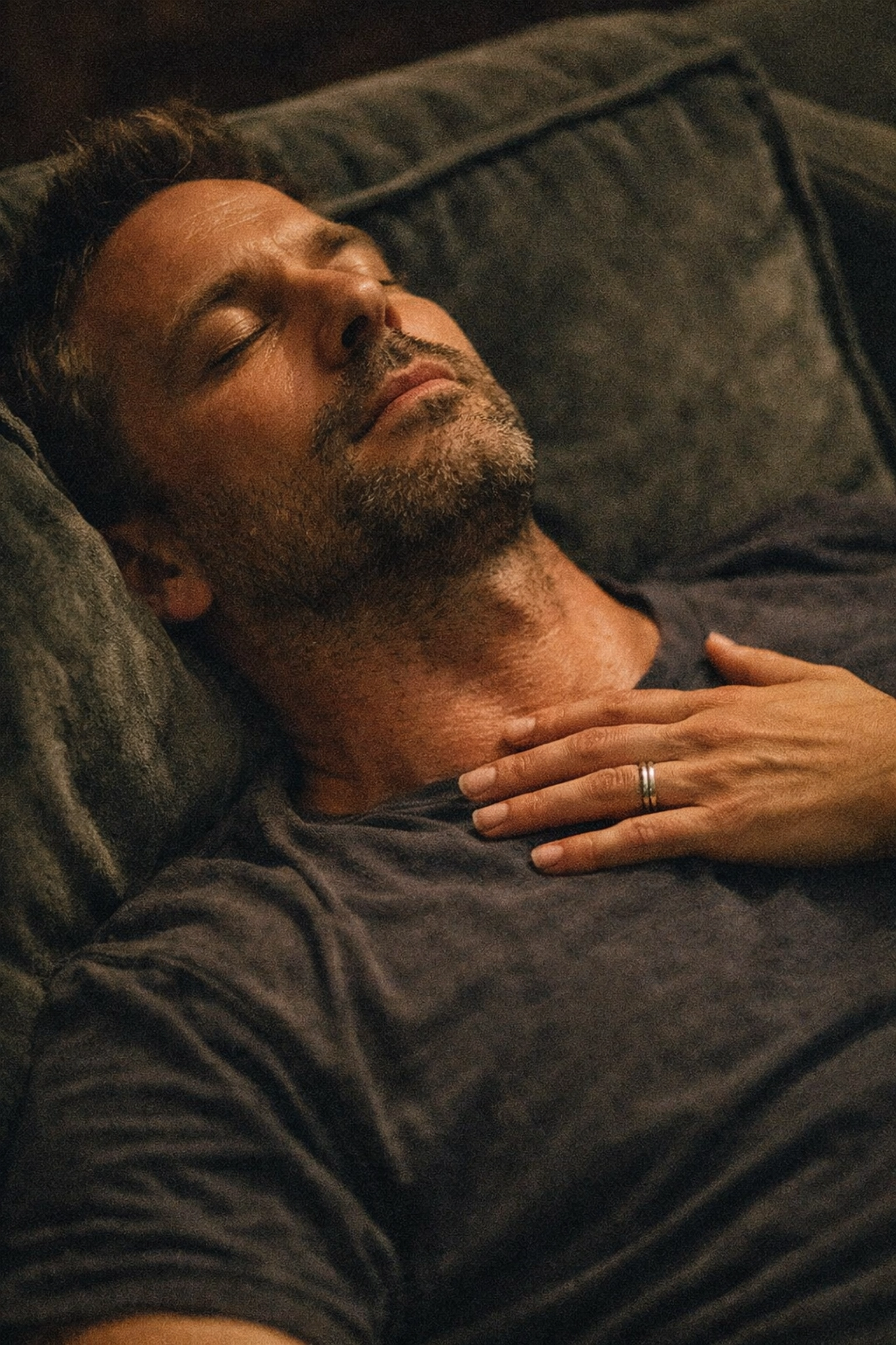 Breathwork for somatic release: a man practicing surrender and trust on a sofa.