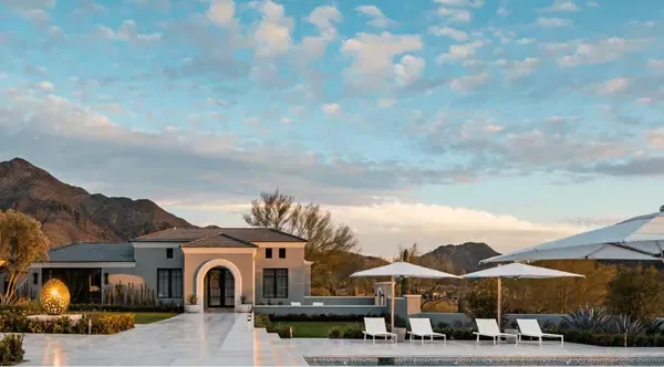 Modern single-story home with a swimming pool and mountain views