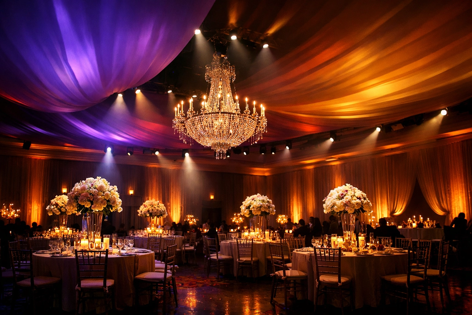 Professional wedding lighting design with uplights and spotlights transforming reception atmosphere