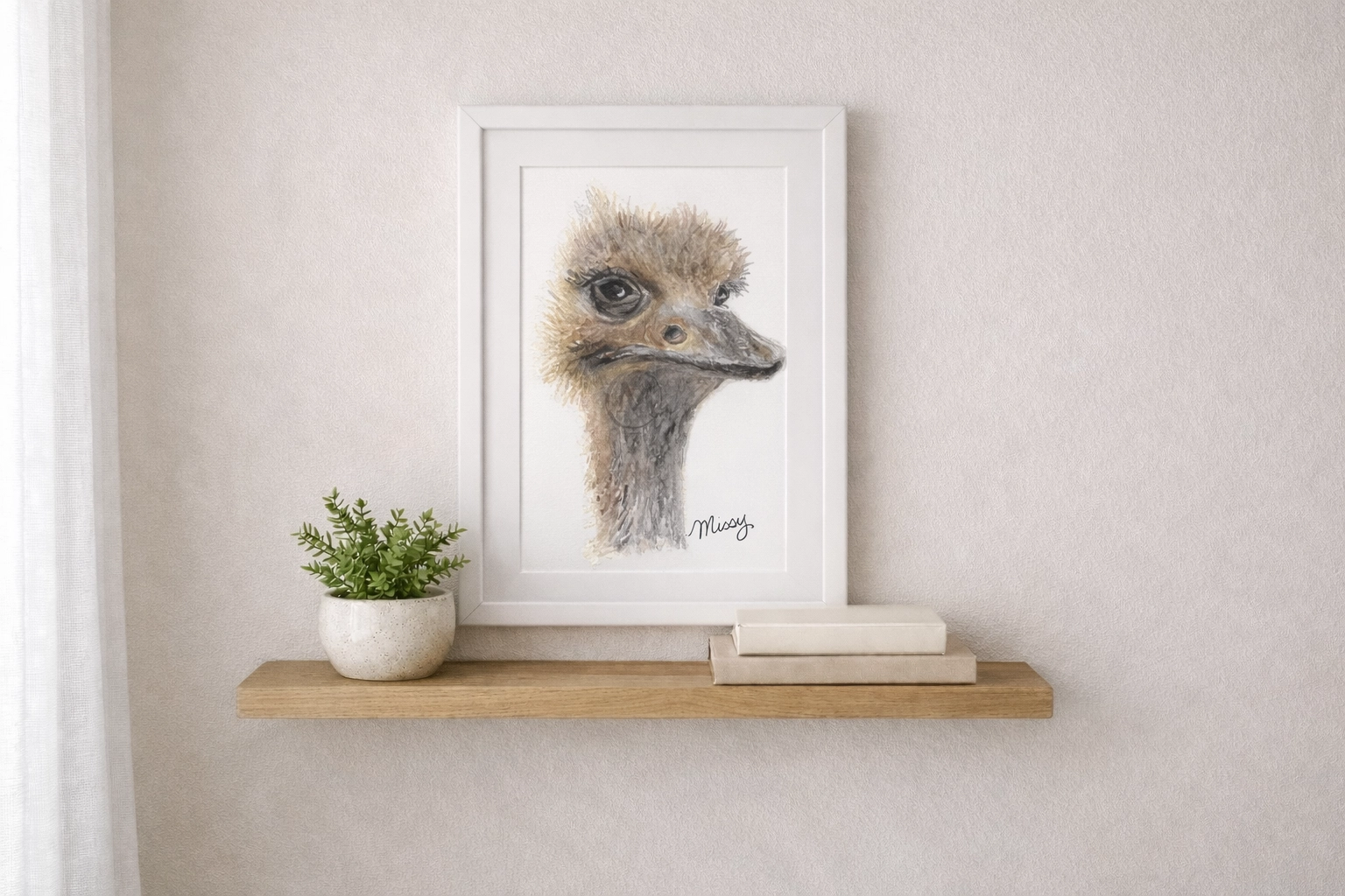 Ostrich watercolor print framed on a wall (lifestyle mockup)