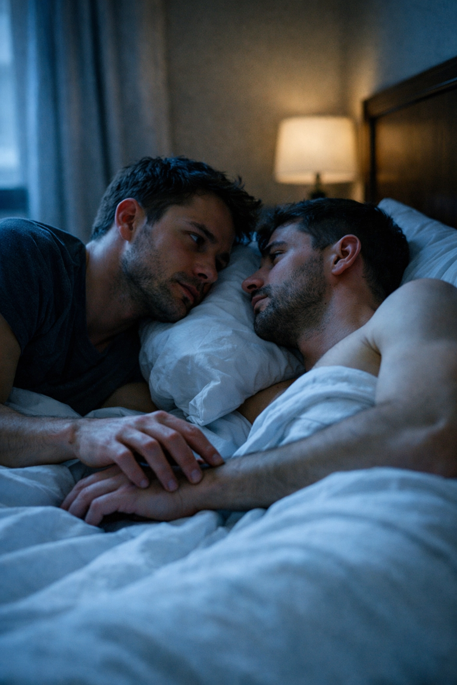 Two men sharing a single bed, illustrating the forced proximity trope found in popular gay romance novels.