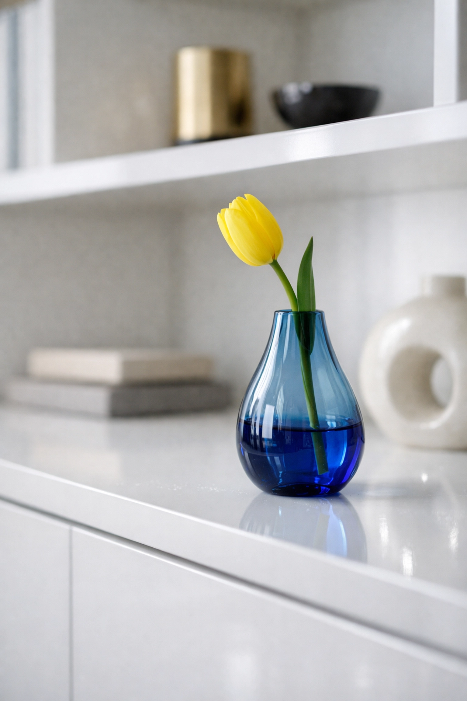 Clean living room shelves with a vase, highlighting the detail-oriented approach of professional house cleaners.