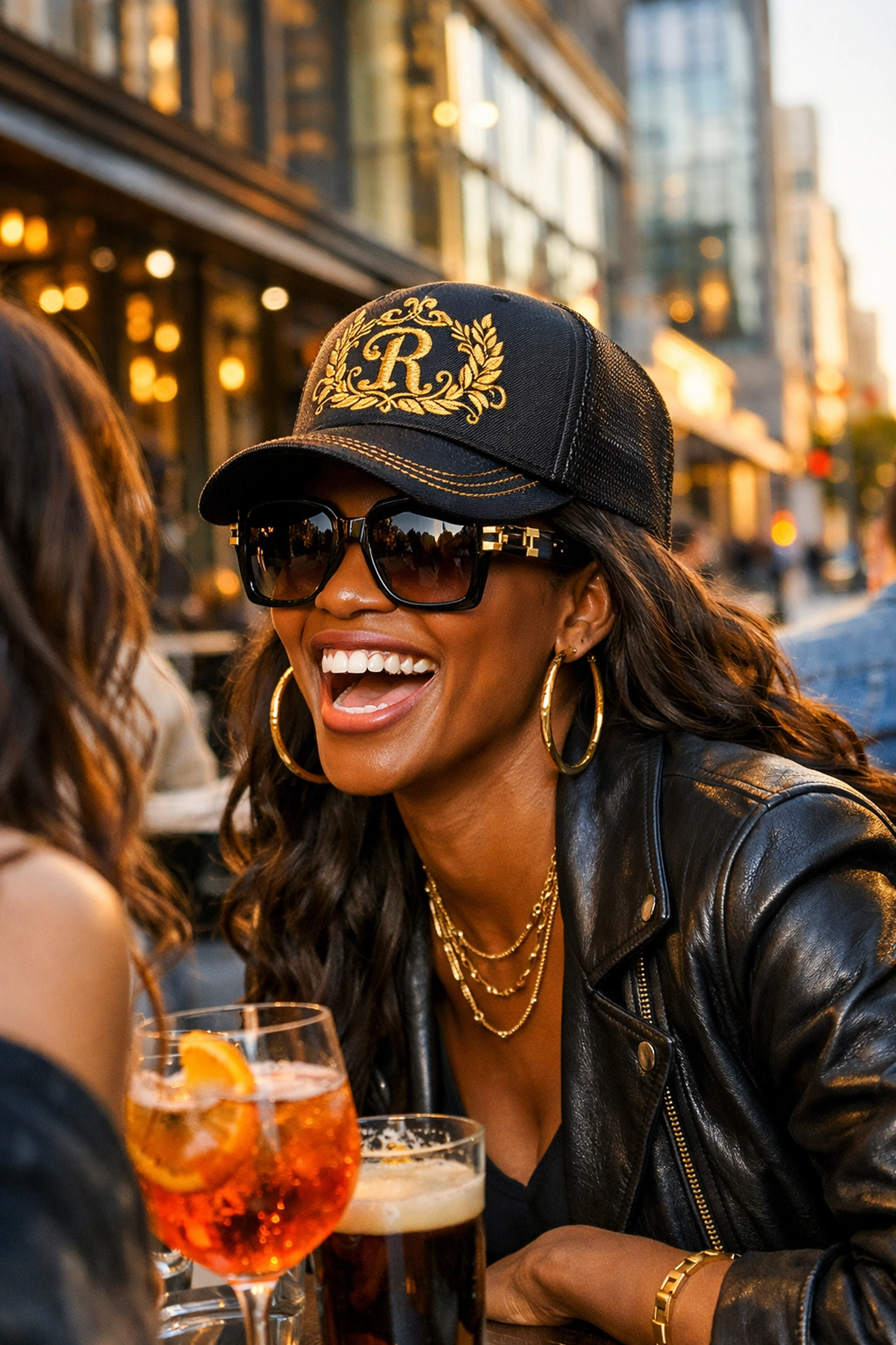 Black Wall Street Matters: How We’re Rebuilding Economic Power One Purchase at a Time A stylish Black woman wearing a premium gold-embroidered trucker hat at an urban café.