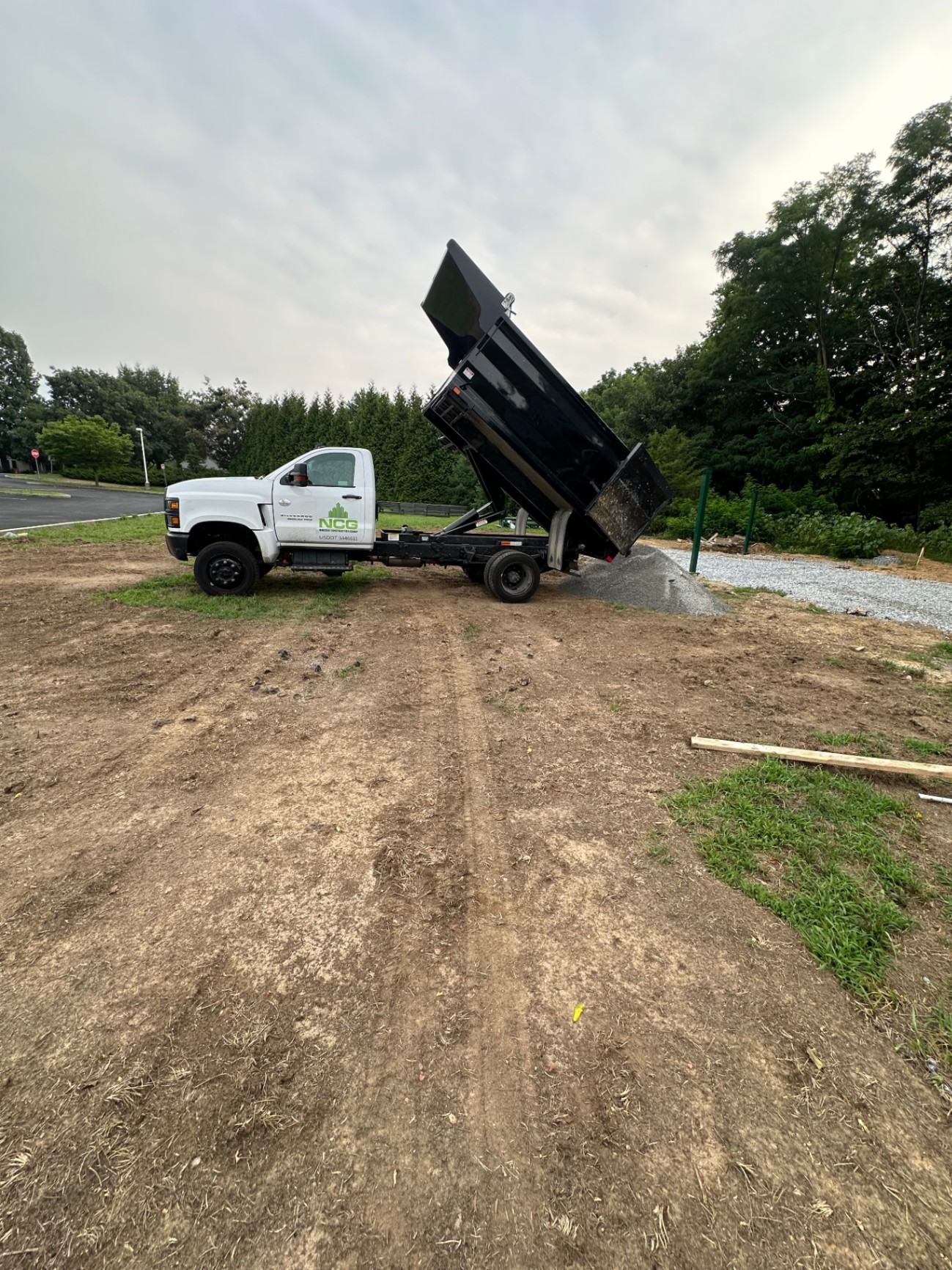 Narcise Construction Group dump truck unloading materials
