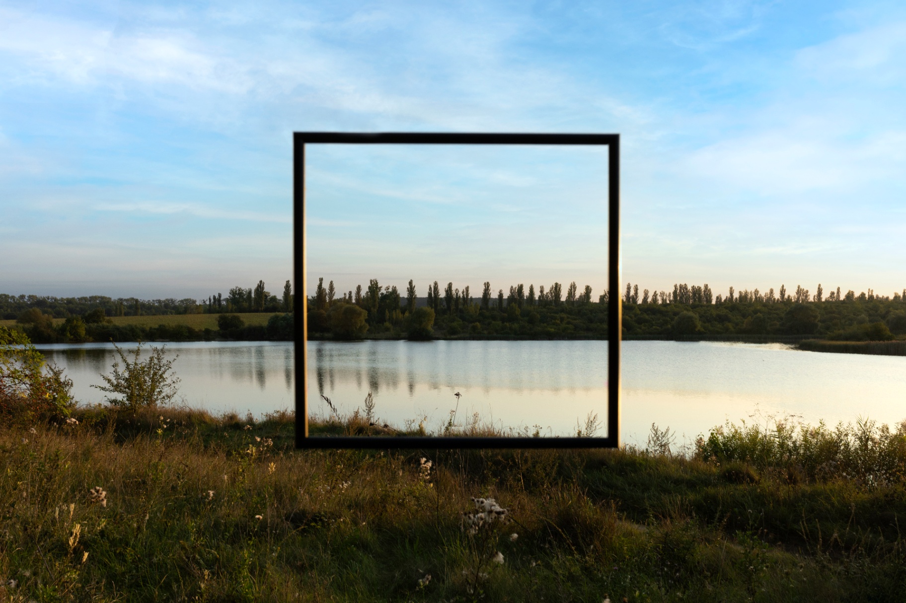 Alchemy of Worlds metal frame at sunset