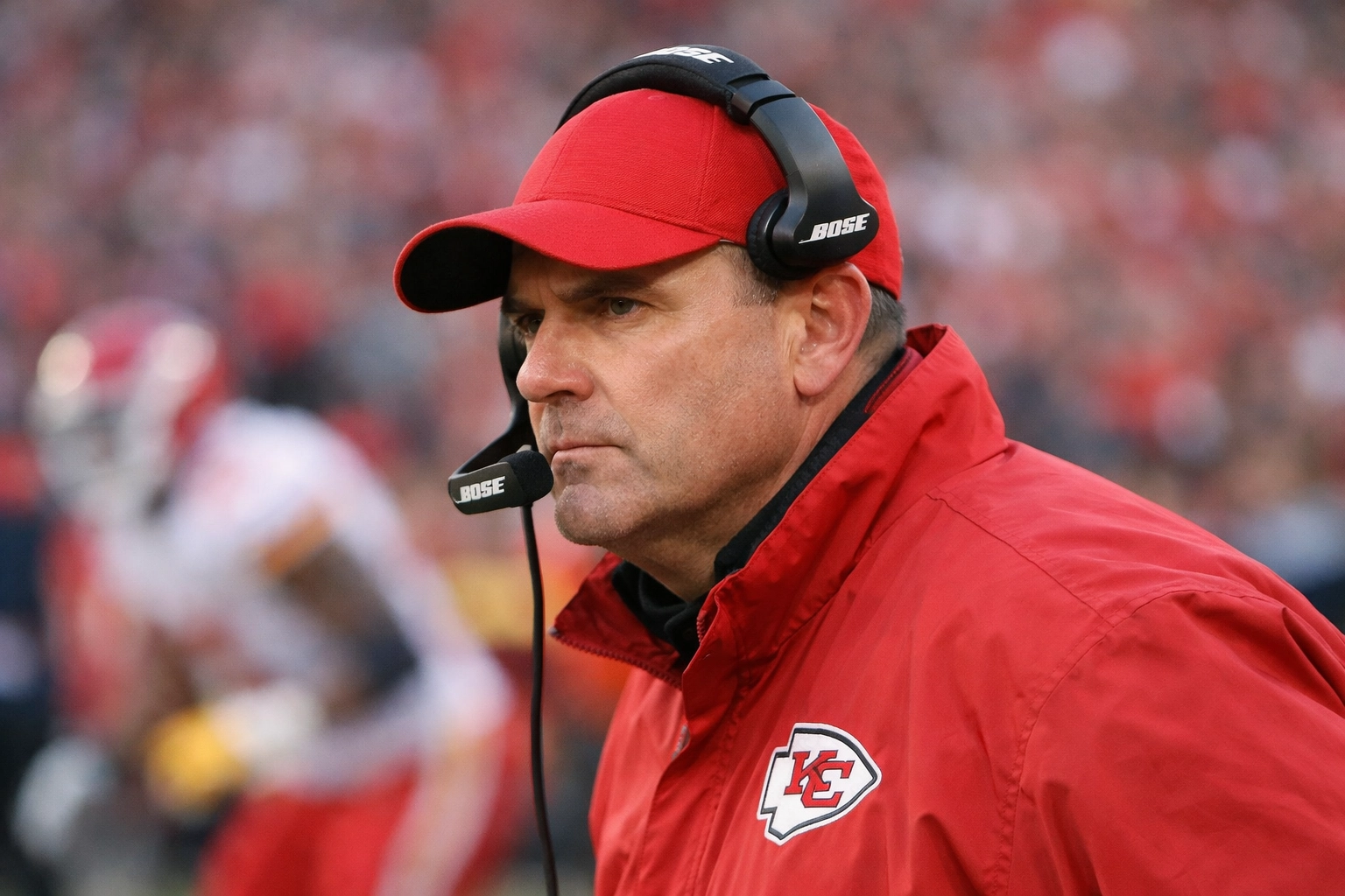 Montreal Alouettes coach on the sidelines focusing on the field during a competitive CFL match.