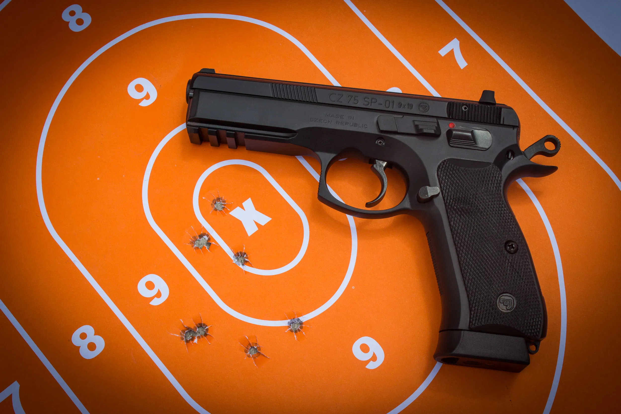 bodyguard training 911 medellin Bodyguard trainees practicing handgun shooting techniques at an outdoor range as part of Elite Bodyguards' firearm safety and tactical training course. The image shows close-up focus on grip, stance, and accuracy drills under instructor supervision, ensuring elite standards of armed protection for clients.
