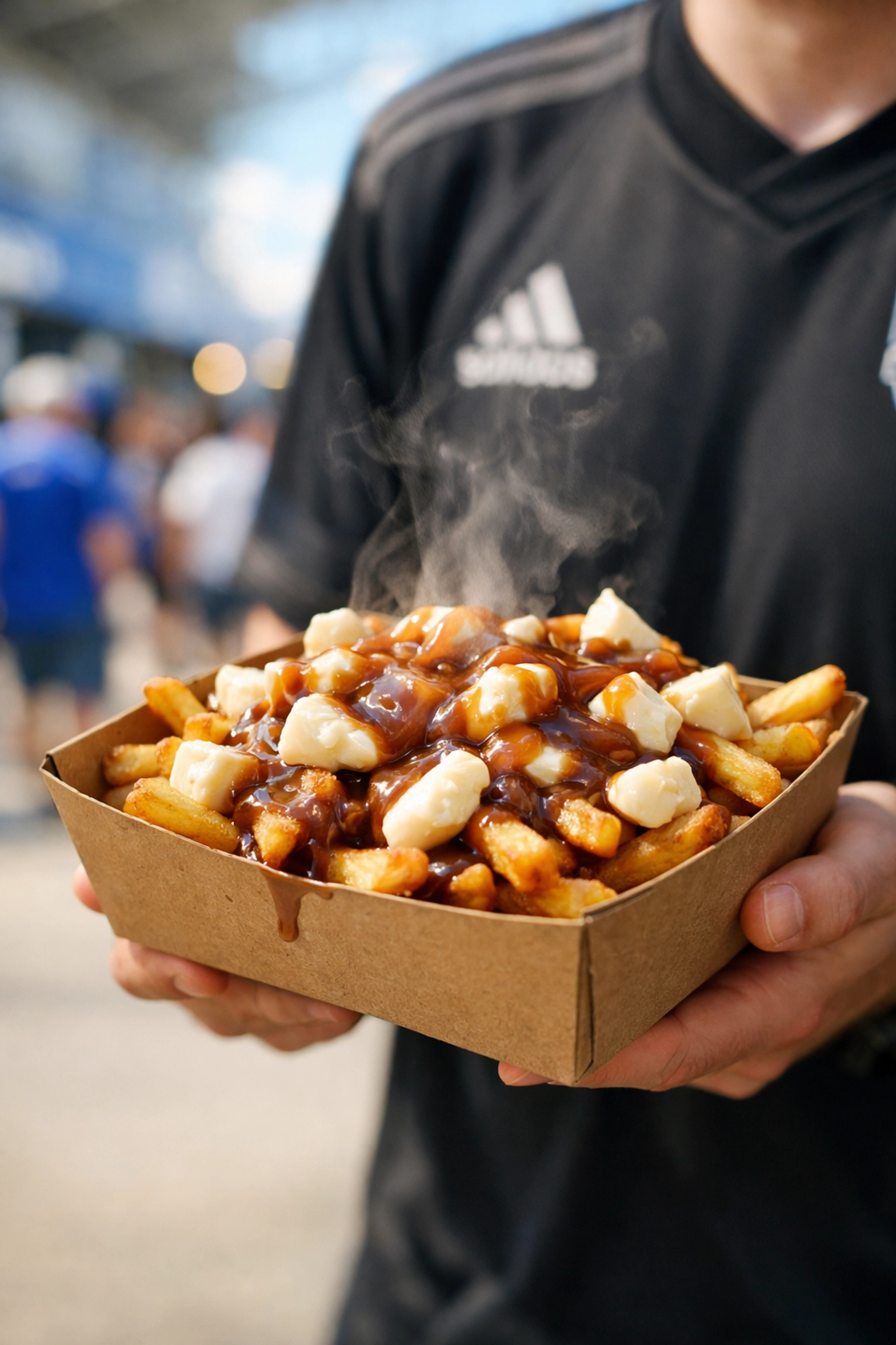 A delicious Montreal poutine with gravy and cheese curds served at a Stade Saputo concession stand.