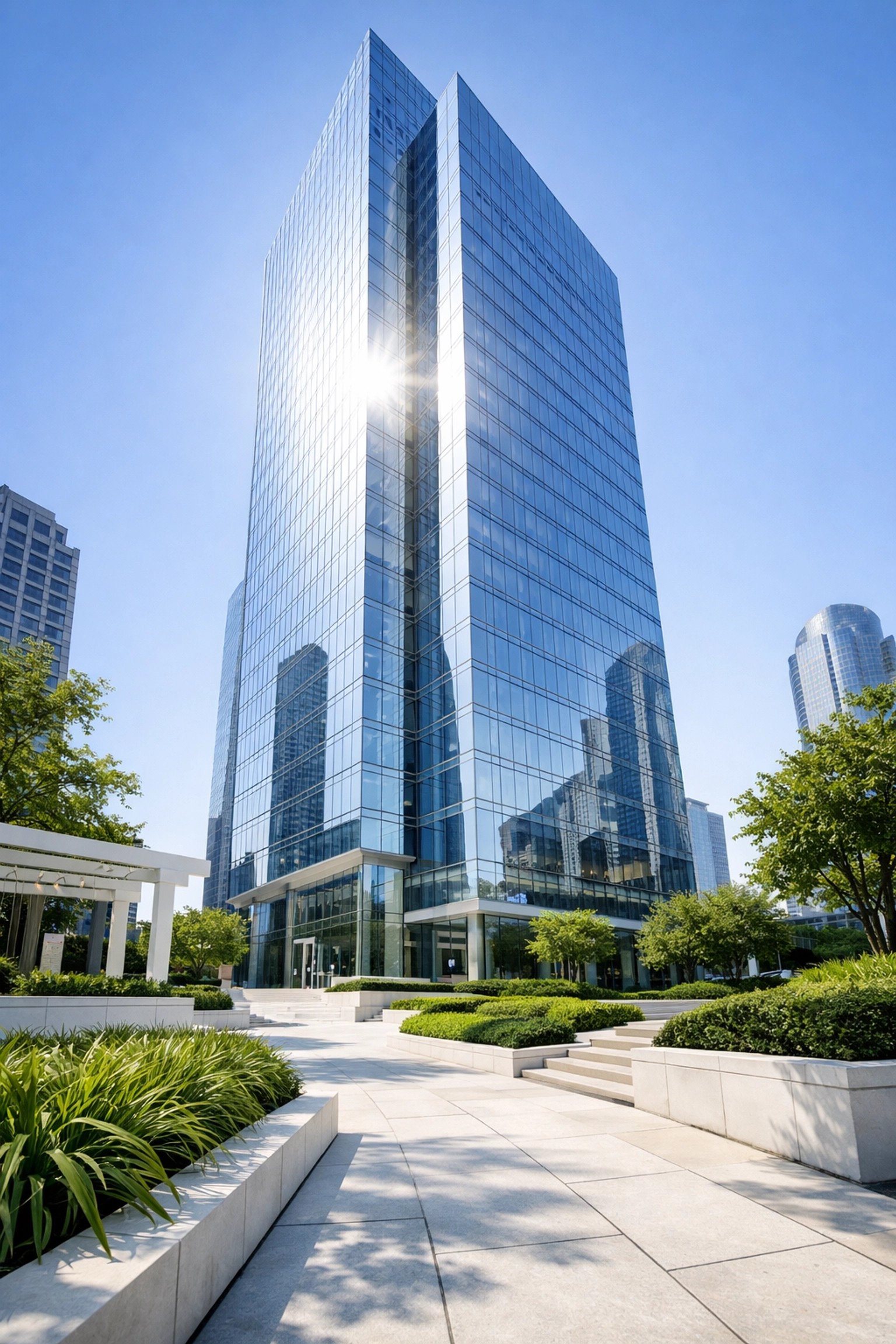 Modern glass office tower in Dallas Uptown representing commercial real estate investment opportunities.
