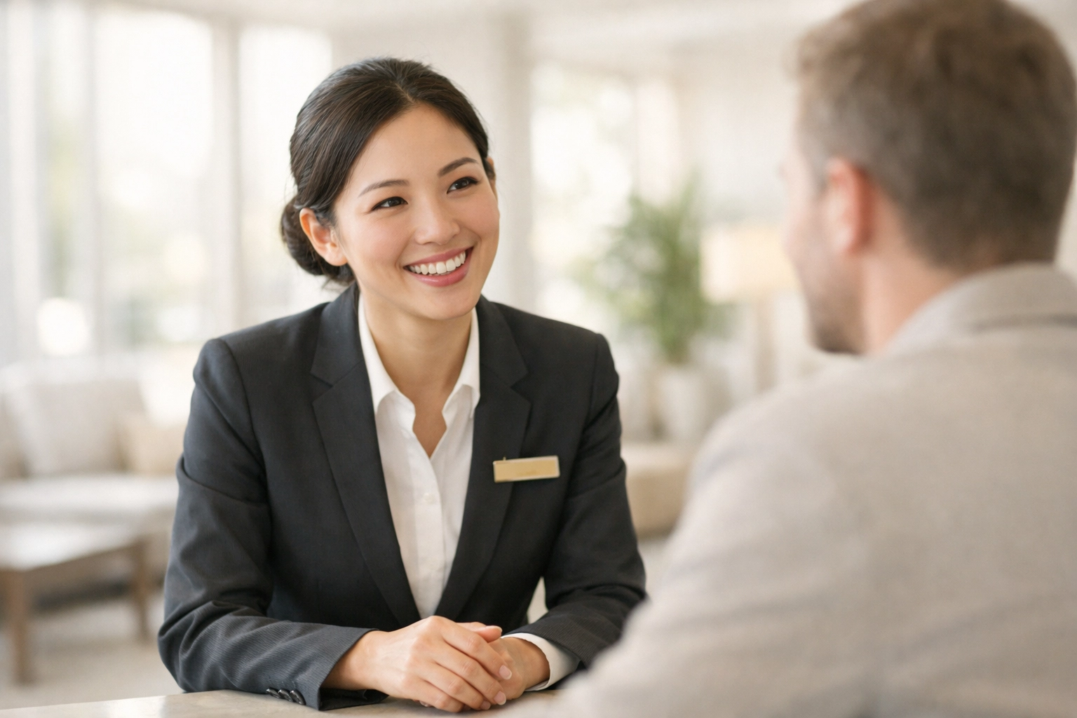 Hotel staff providing excellent guest service using modern cloud-native technology