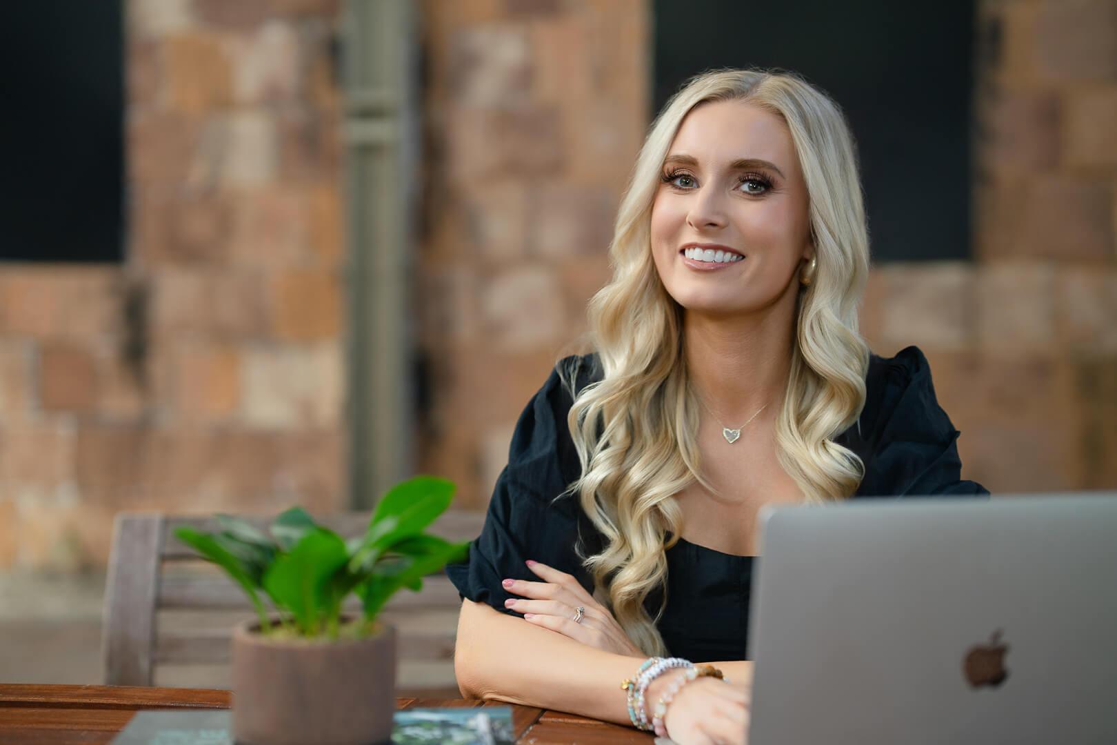 Young entrepreneur working at a table with a laptop in a coffee shop