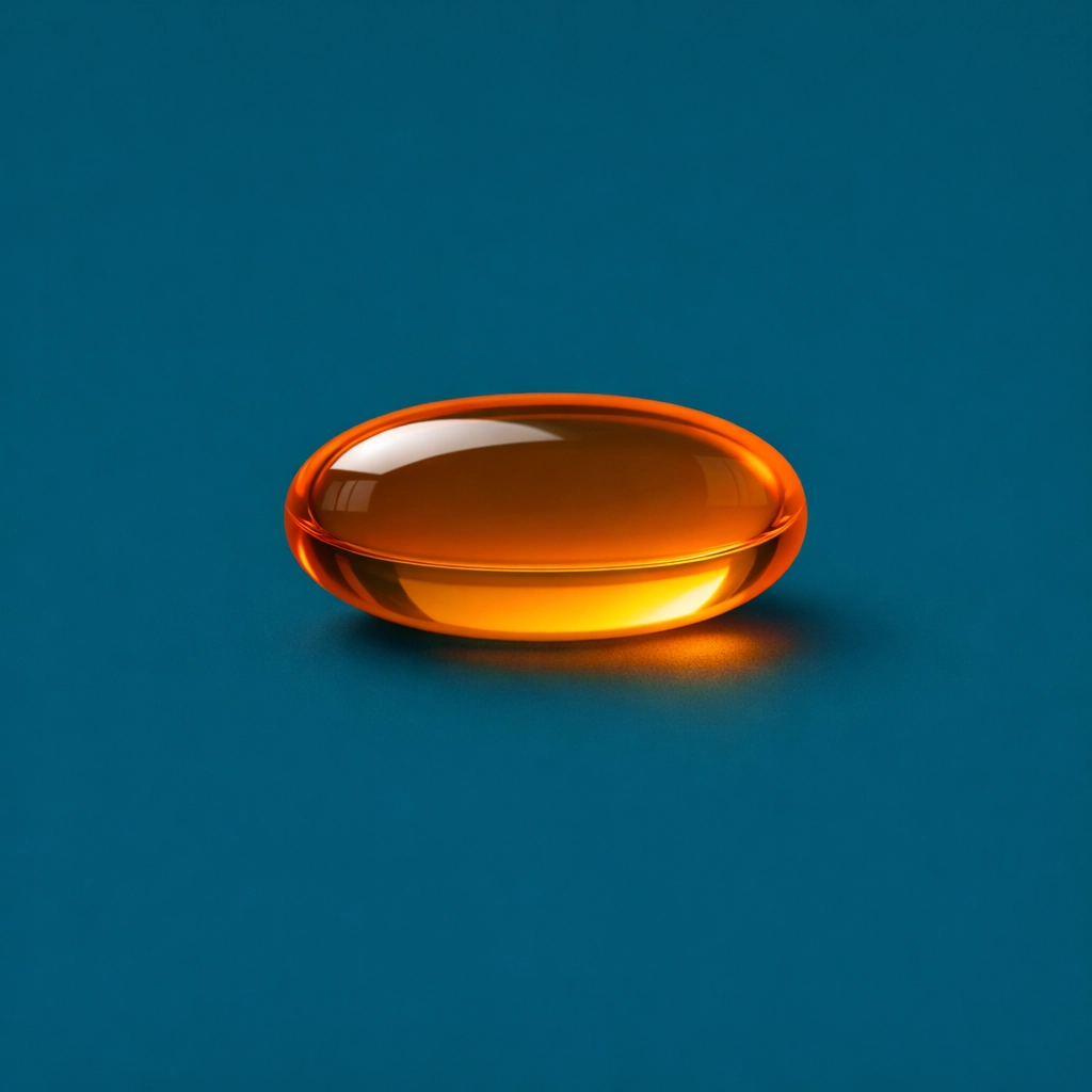 An orange CoQ10 softgel capsule highlighting heart health and antioxidant support for healthspan.
