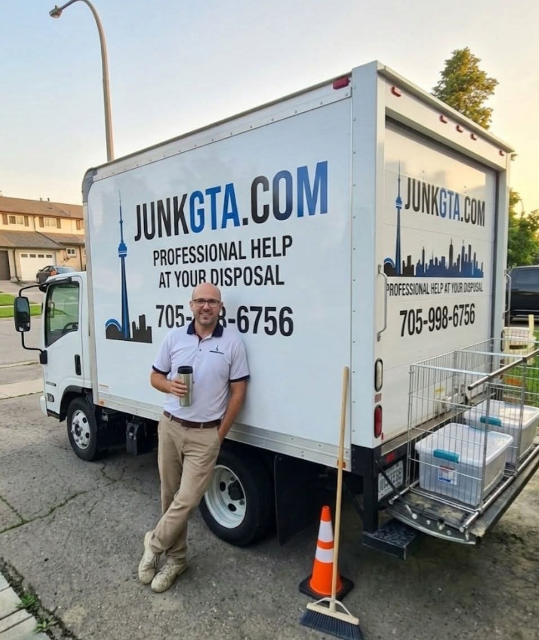 Efficient Garage Cleanout Services in East Gwillimbury: Reclaim Your Space junk-removal-team-member-beside-truck-residential-neighborhood.jpg