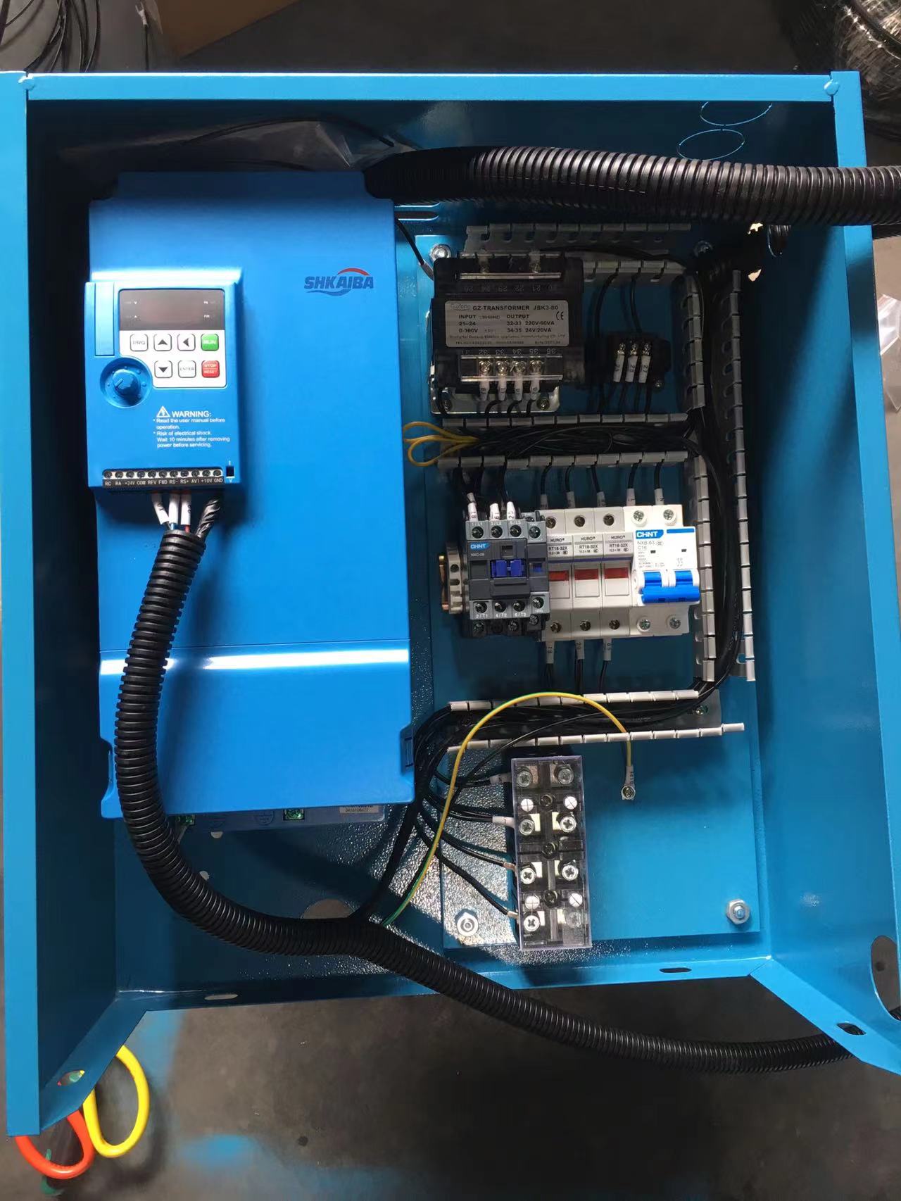 PMV Screw Air Compressor Internal Electrical Control Panel featuring a variable frequency drive, transformer, circuit breakers, and terminal blocks.