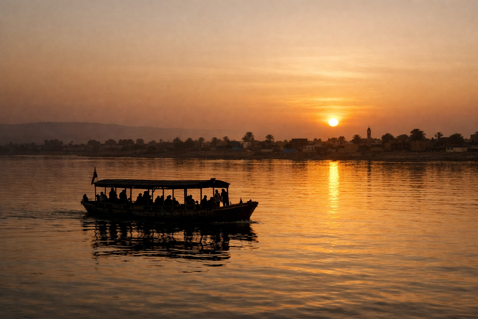 Traditional ferry boat on the Nile River in Sudan at sunset