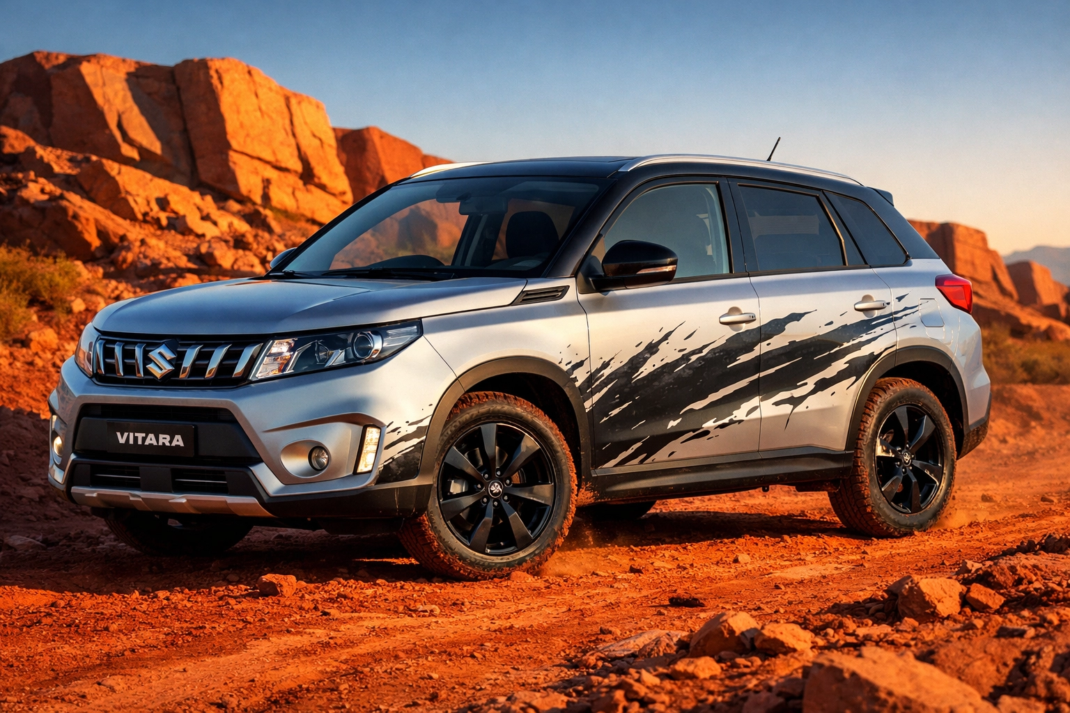 Silver Suzuki Vitara with charcoal grey mud splash vinyl decals on a red dirt off-road trail.