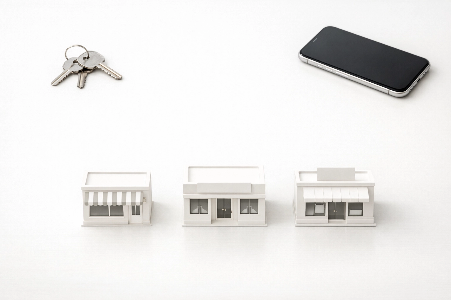 Storefront models and keys illustrating organized franchise bookkeeping and business scaling solutions.