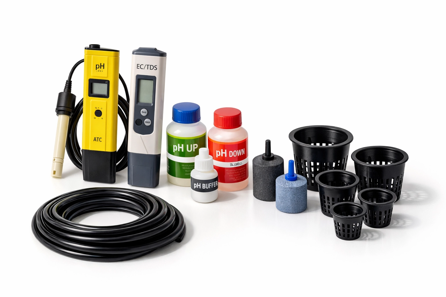 Essential hydroponic equipment including pH meter, air stones, and net pots for indoor gardening